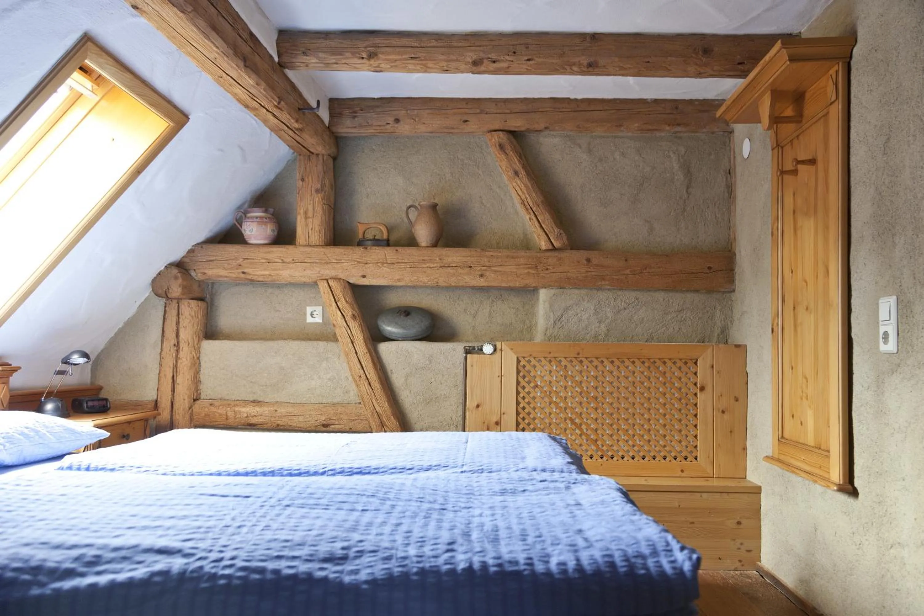 Bed in Naturhotel Holzwurm