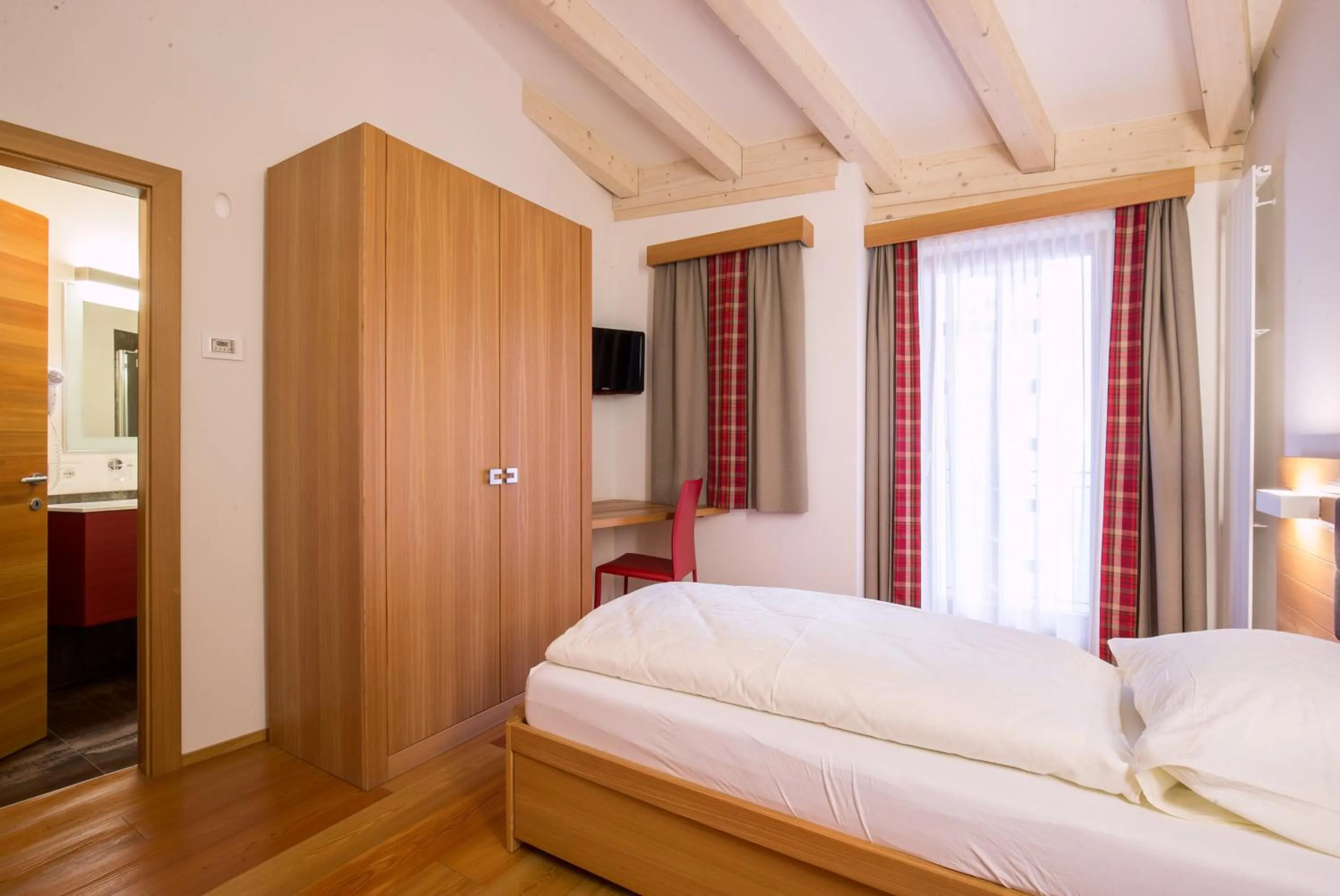 Bed in Hotel Al Cervo