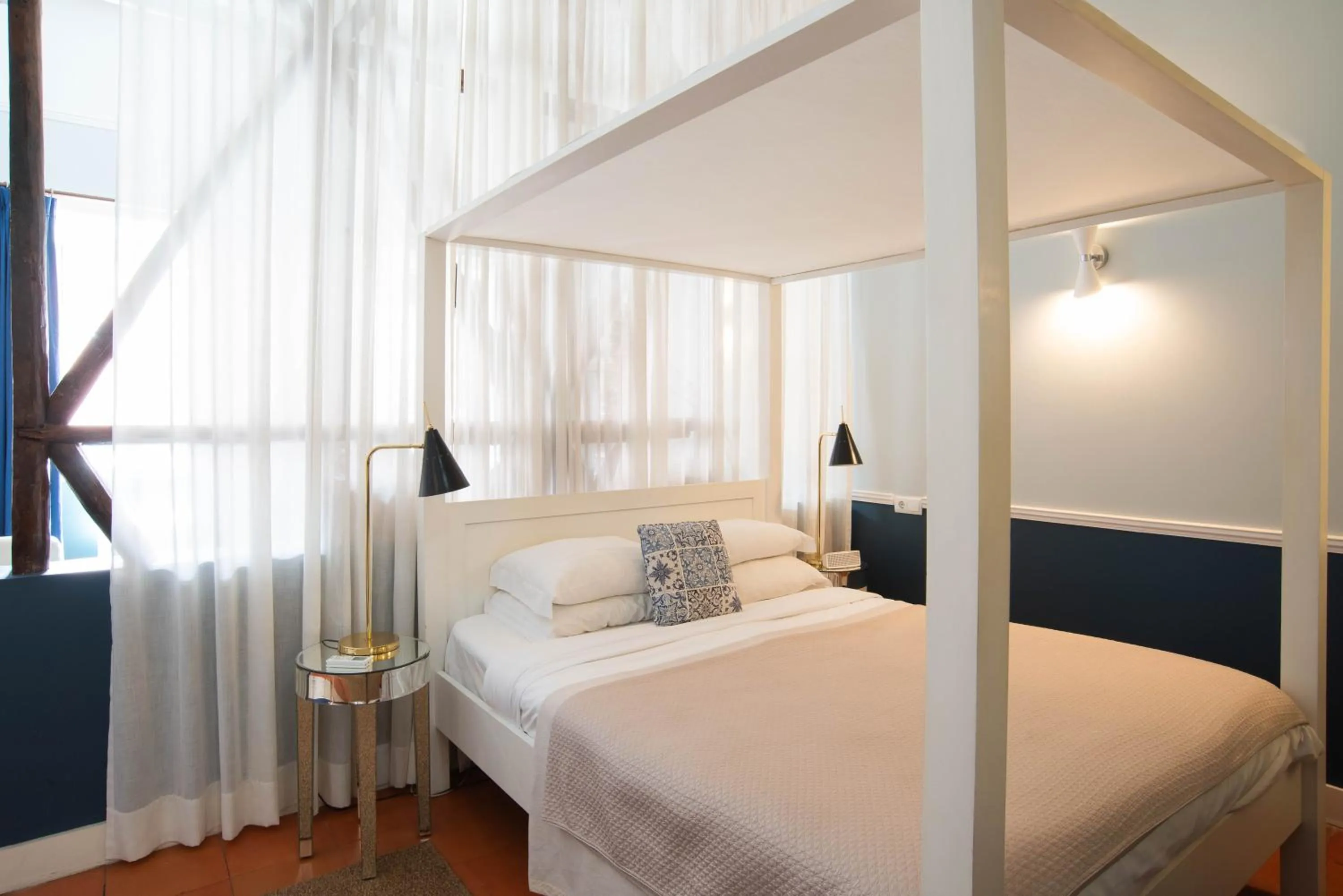 Bed in CASA AMORA Studio Apartments