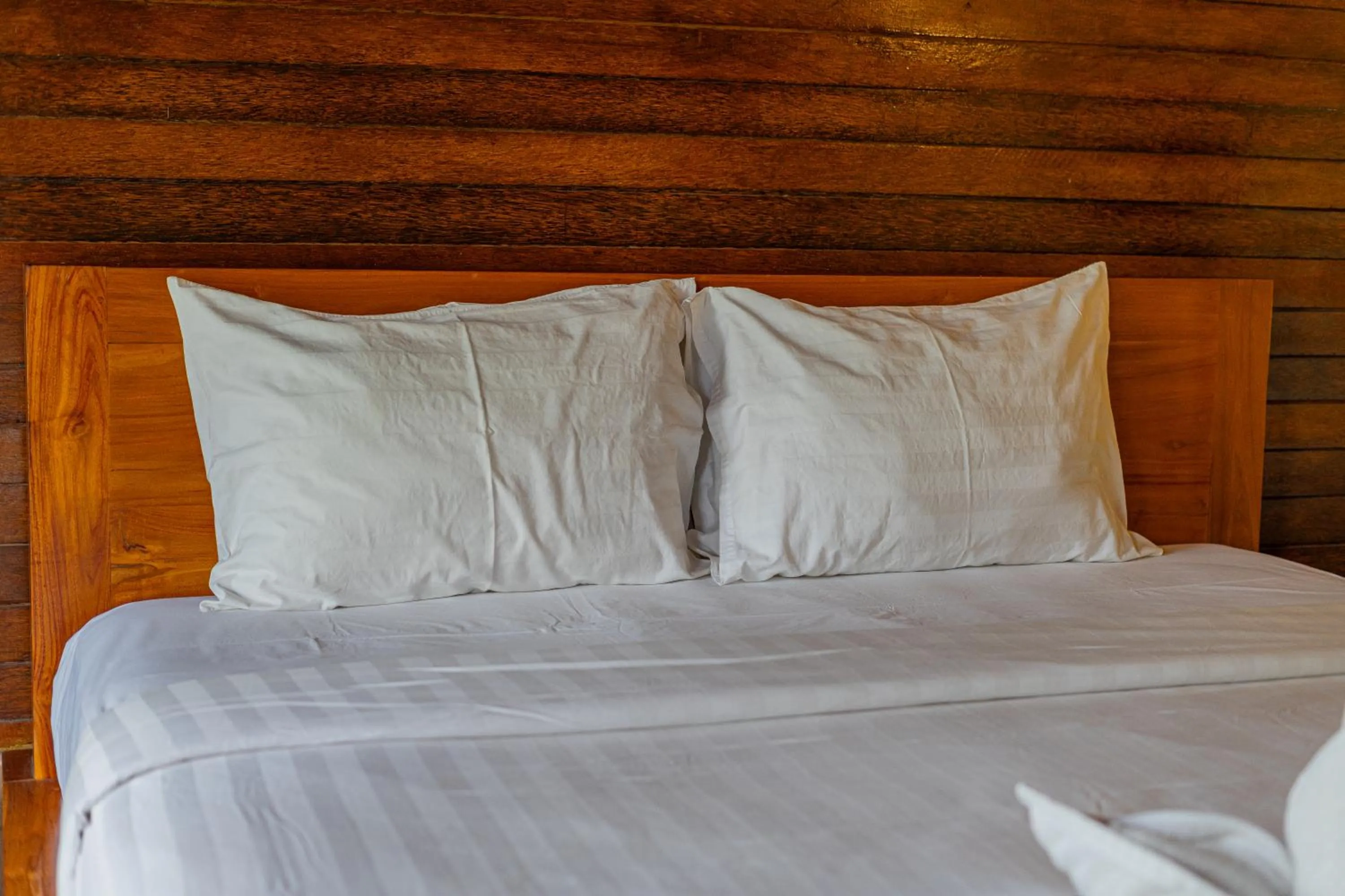 Bed in Rijet Villa Beach & Restaurant