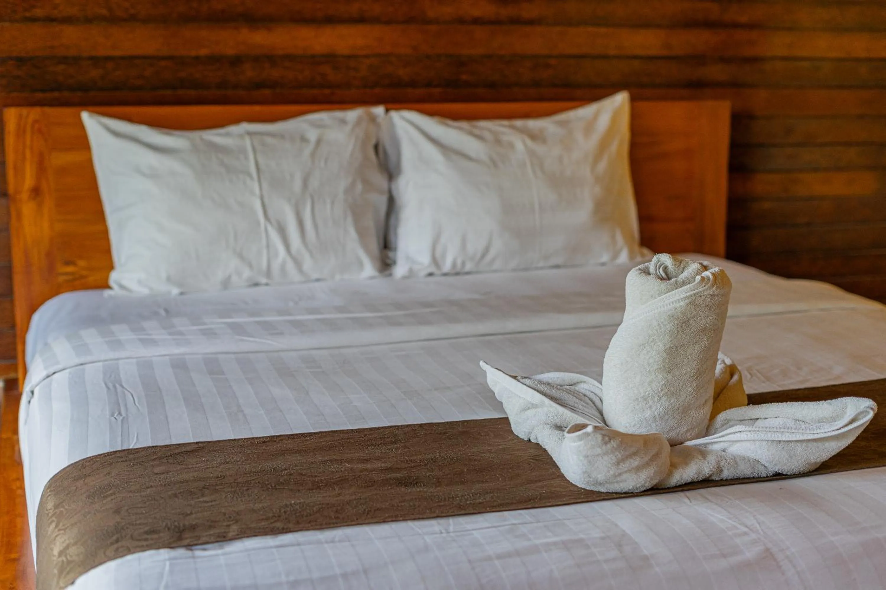 Bed in Rijet Villa Beach & Restaurant