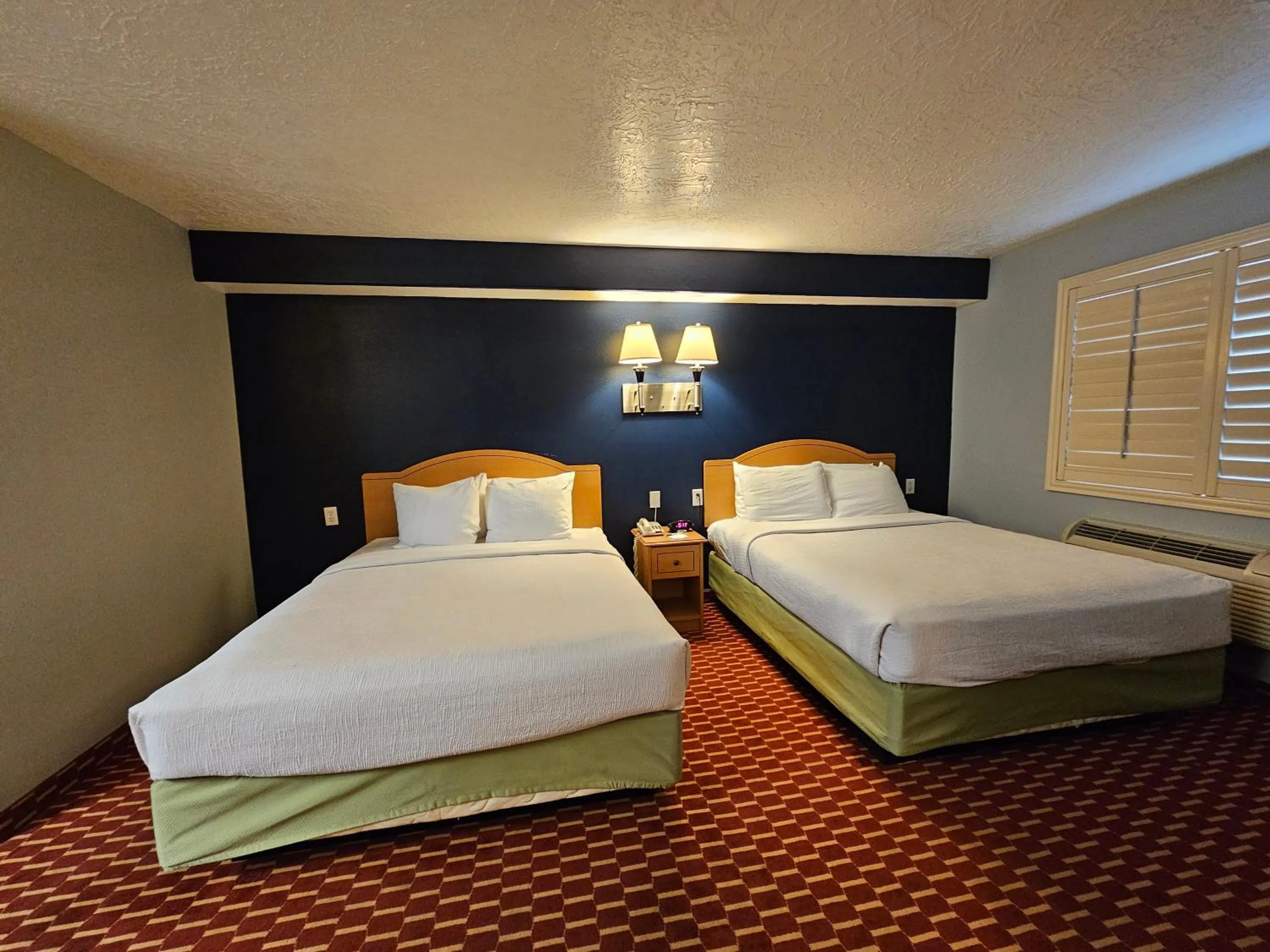 Bed in Executive Inn & Suites Extended Stay - Vernal