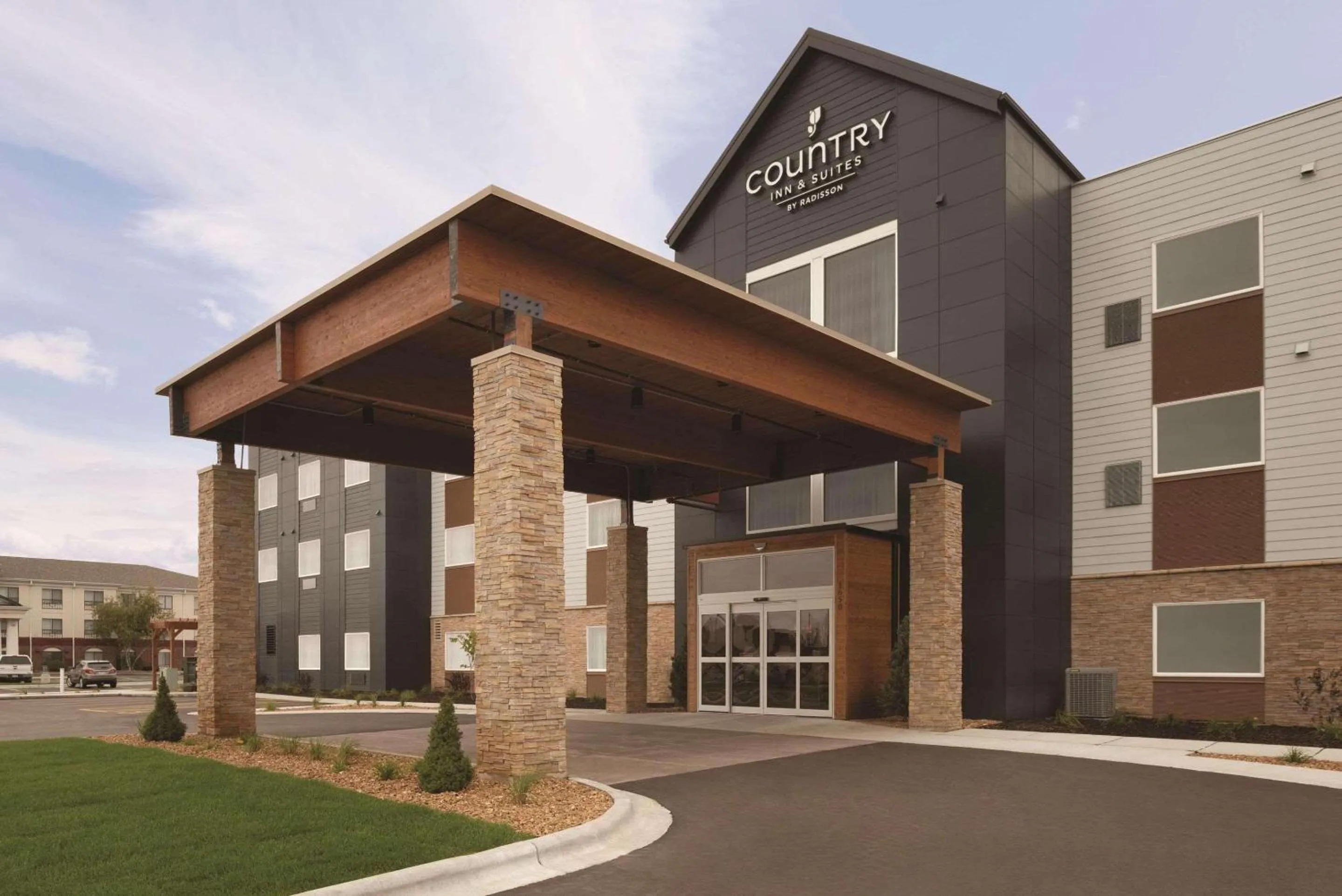 Property building in Country Inn & Suites by Radisson, Ft Atkinson, WI
