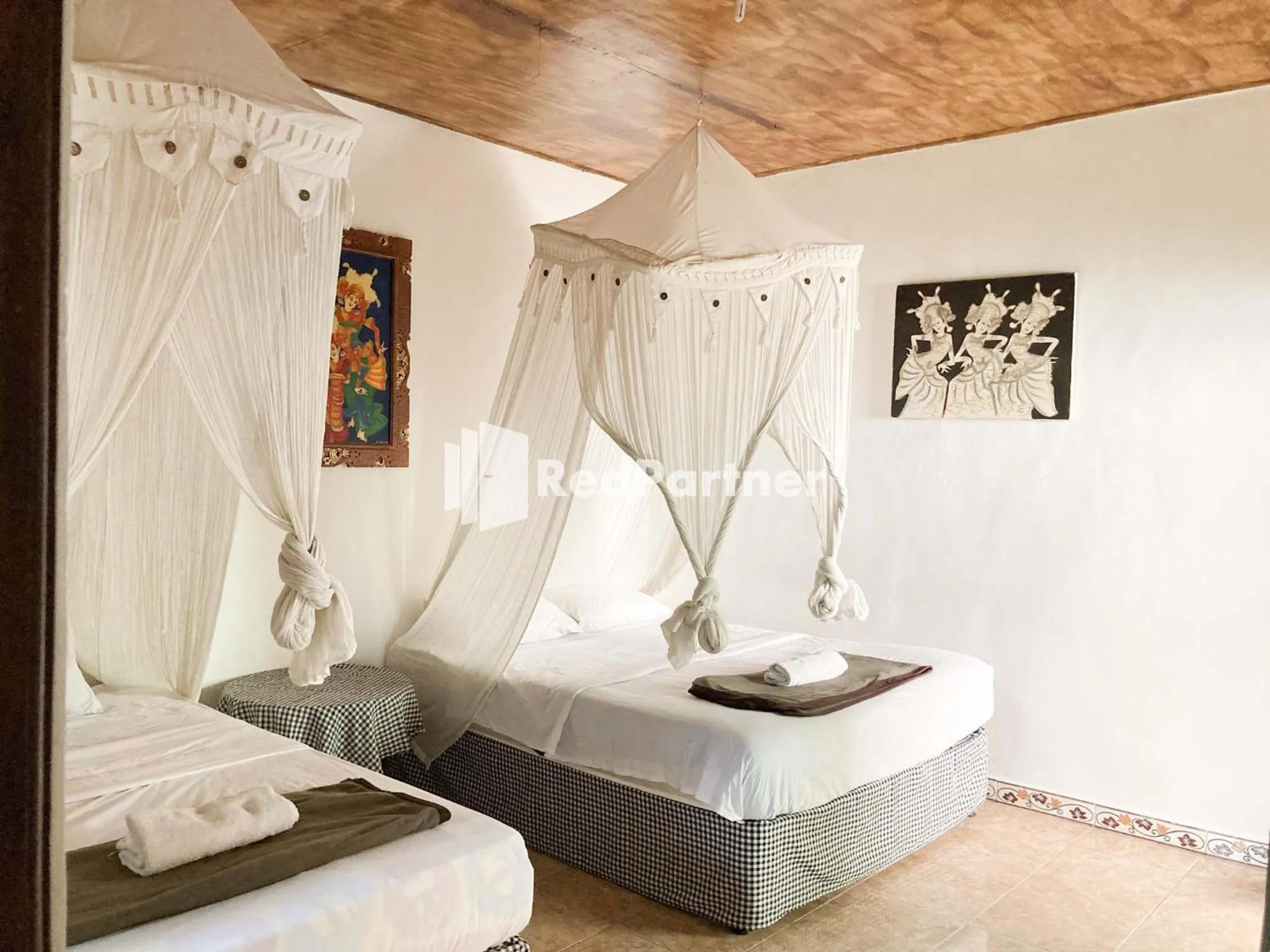 Bed in Taman Ayu Homestay Munduk Mitra RedDoorz