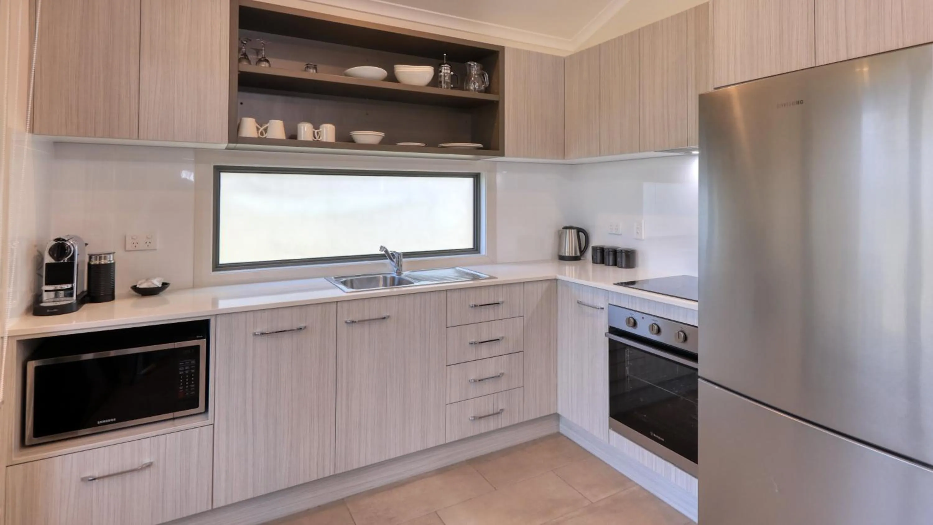 kitchen in Alivio Tourist Park Canberra