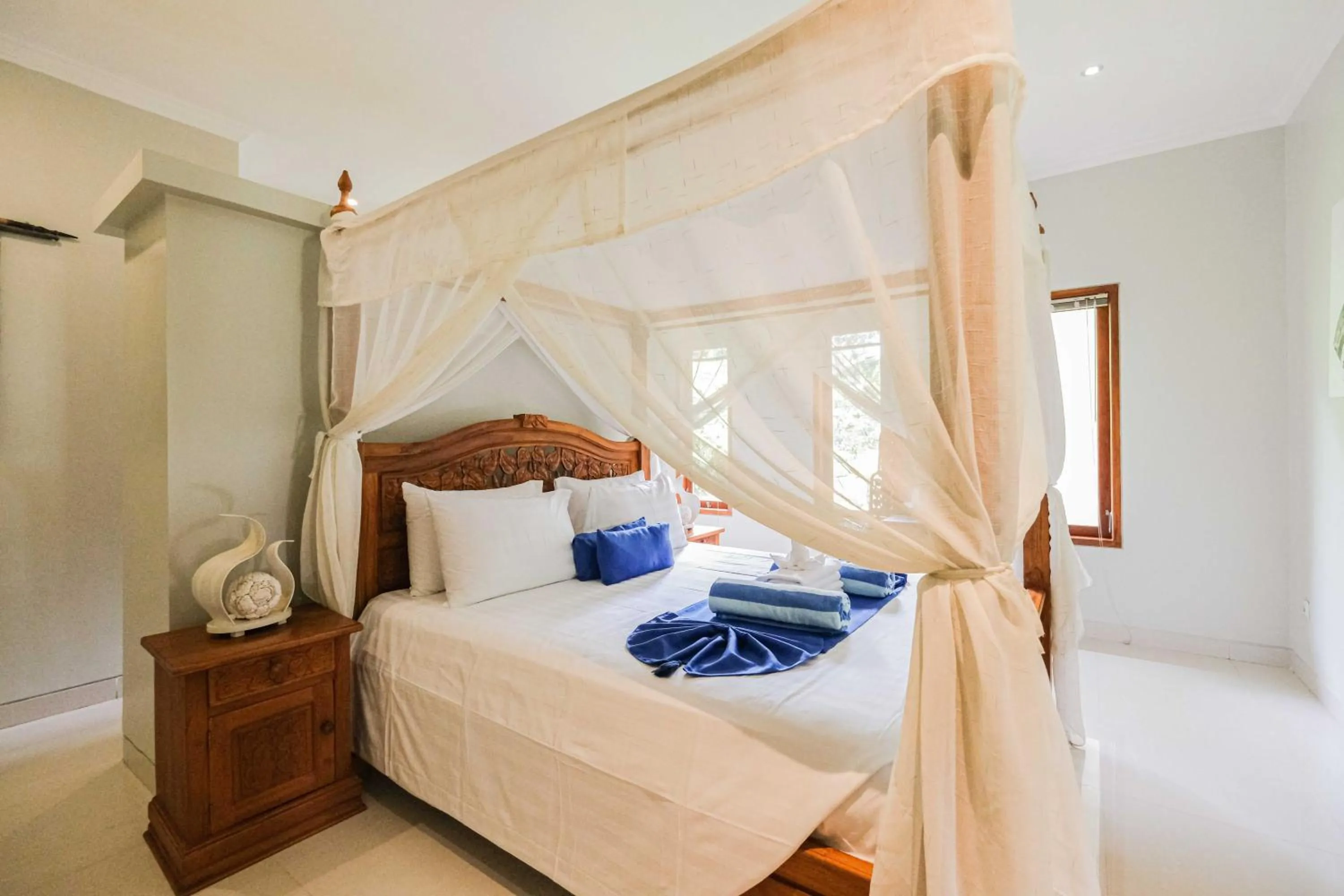 Bed in Poinciana Resort