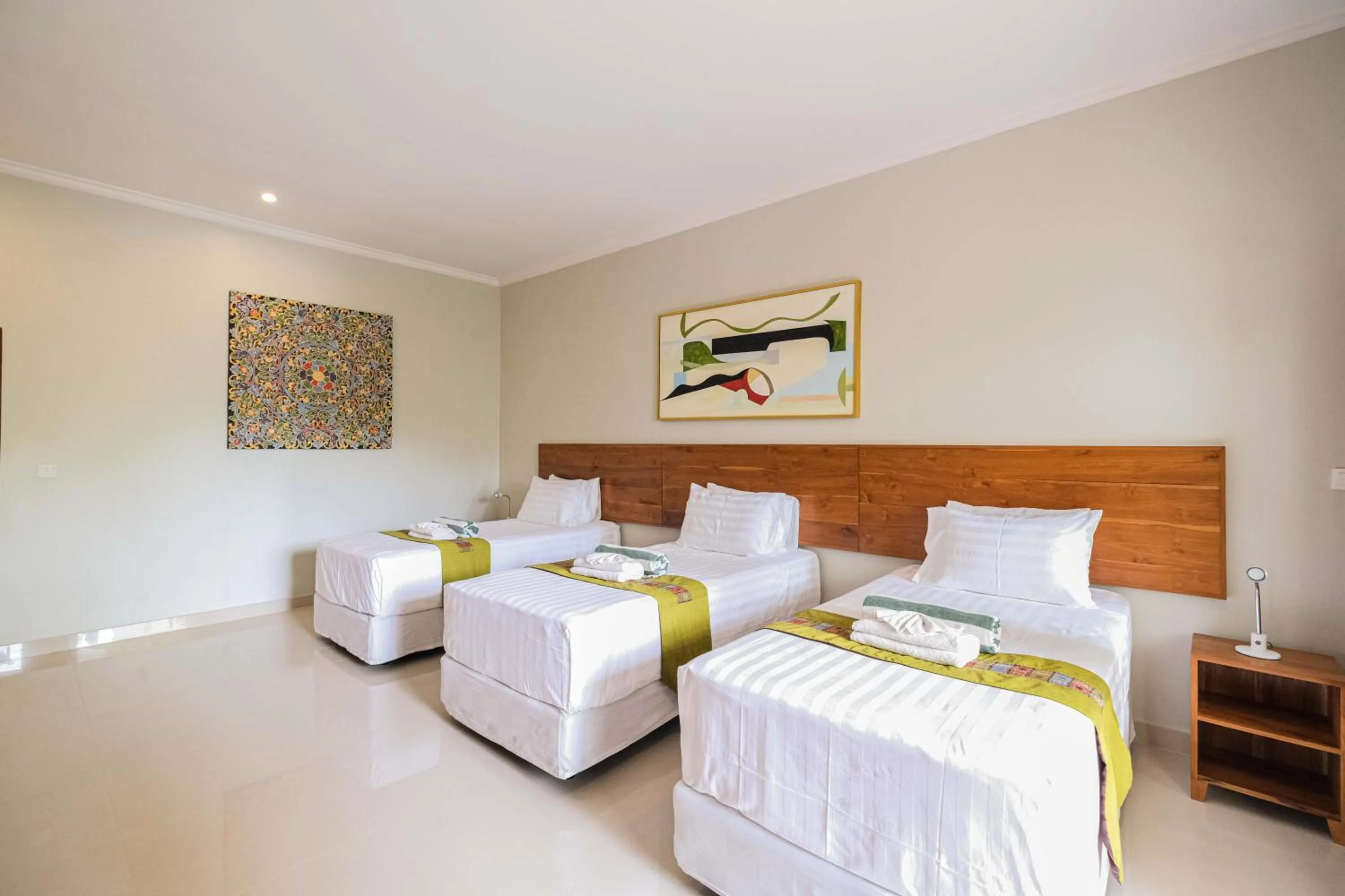 Bed in Poinciana Resort