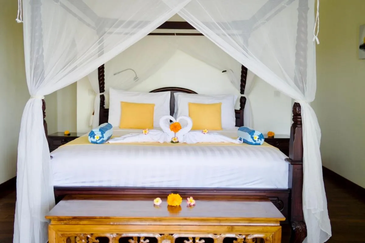 Bed in Poinciana Resort