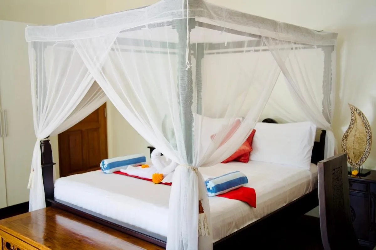 Bed in Poinciana Resort