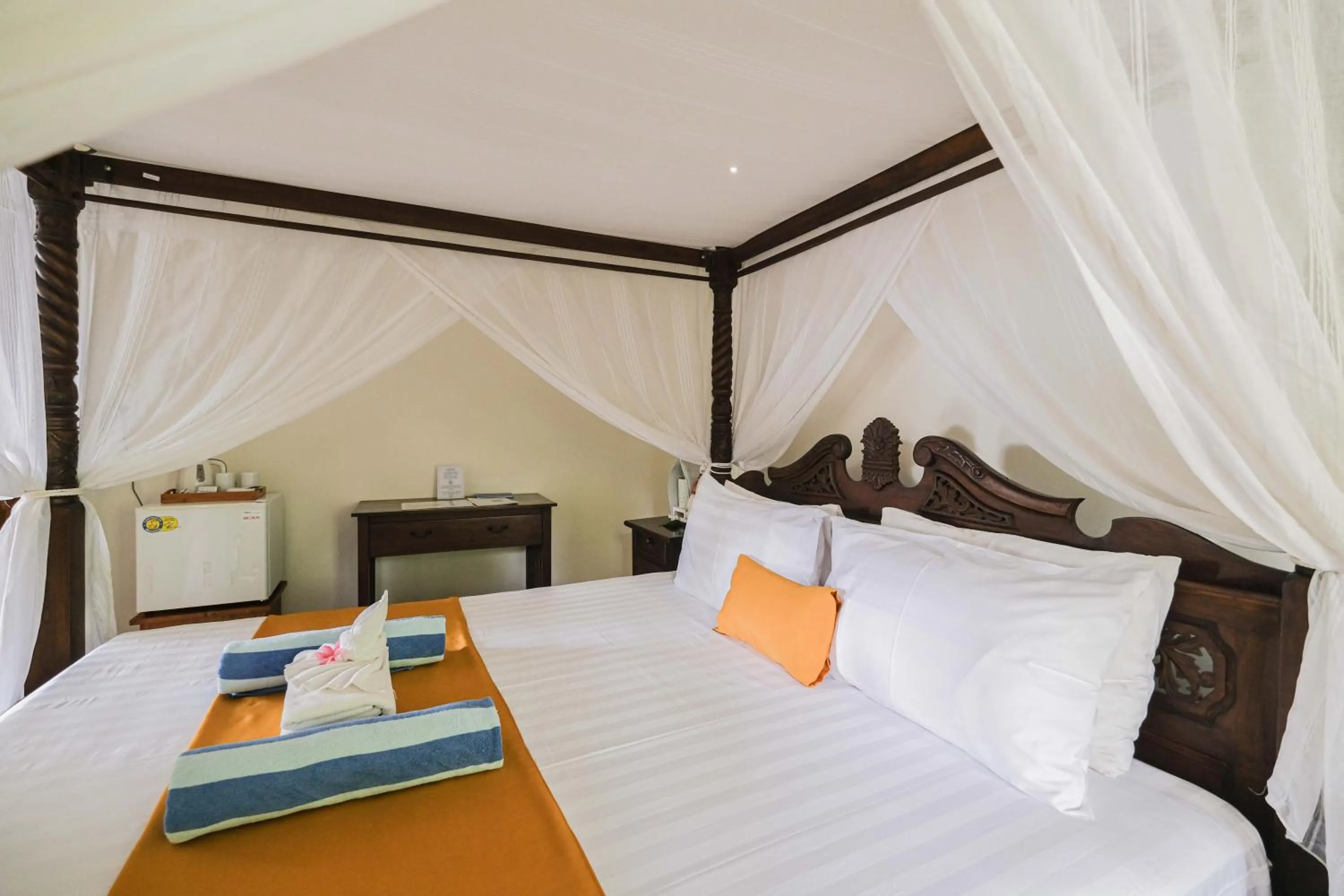 Bed in Poinciana Resort