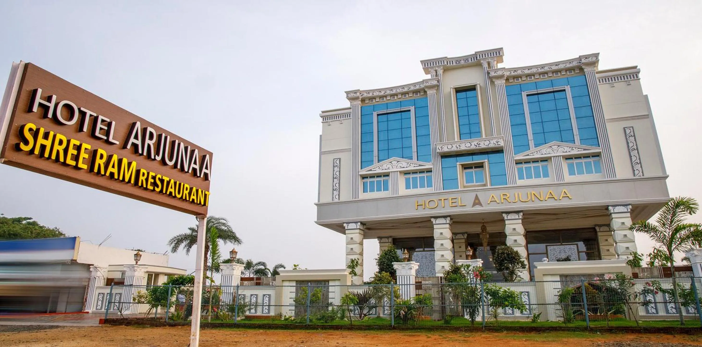 Property logo or sign in Hotel ARJUNAA