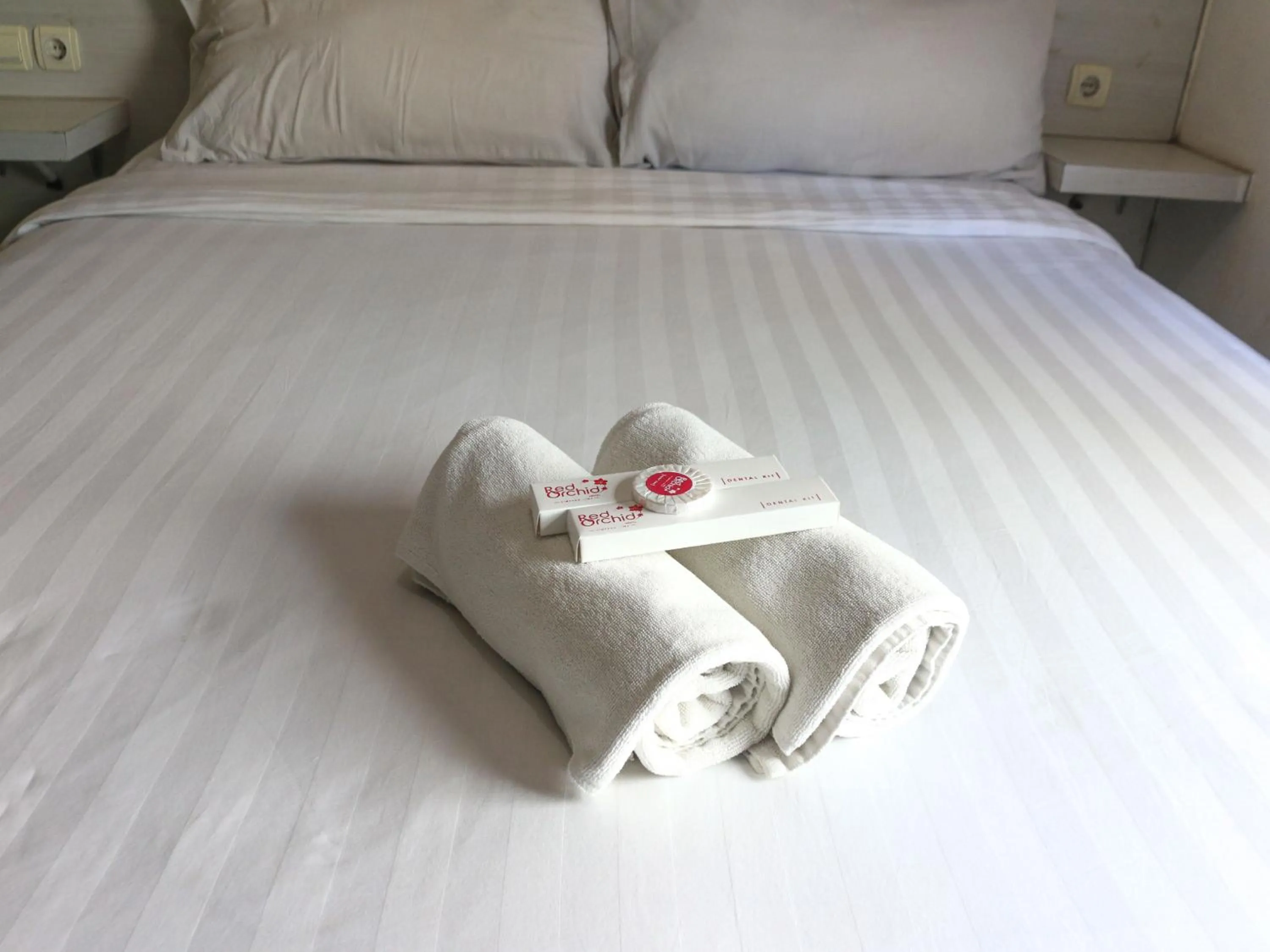 Bed in Red Orchid Hotel by Sajiwa