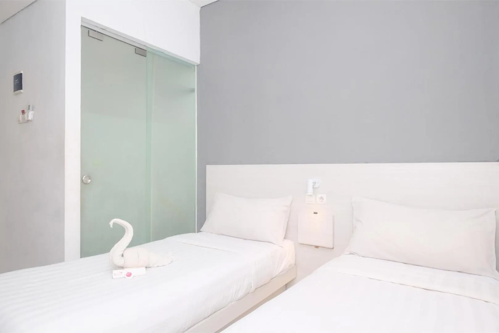 Bed in Red Orchid Hotel by Sajiwa