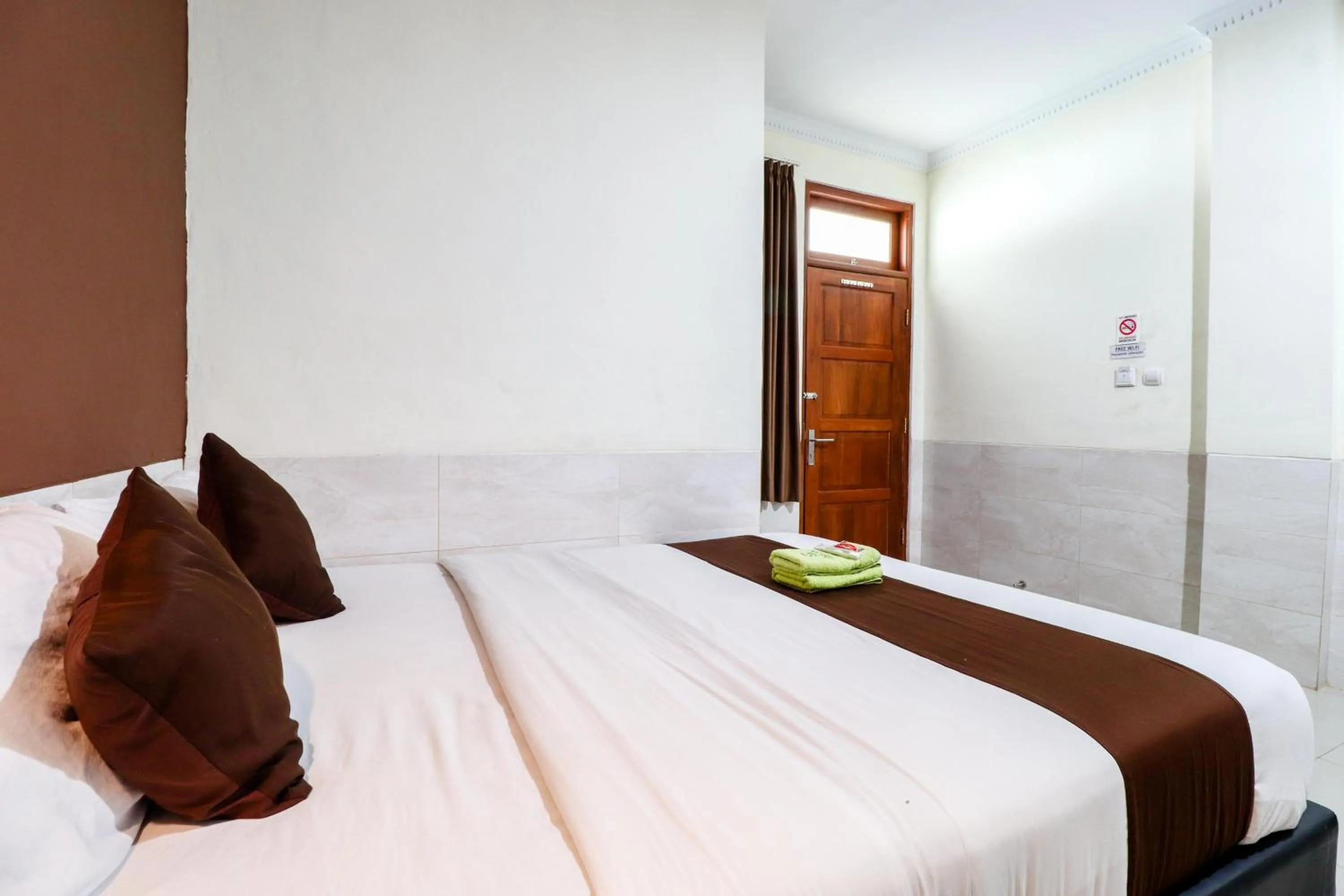 Bed in Hotel Safara Yogyakarta