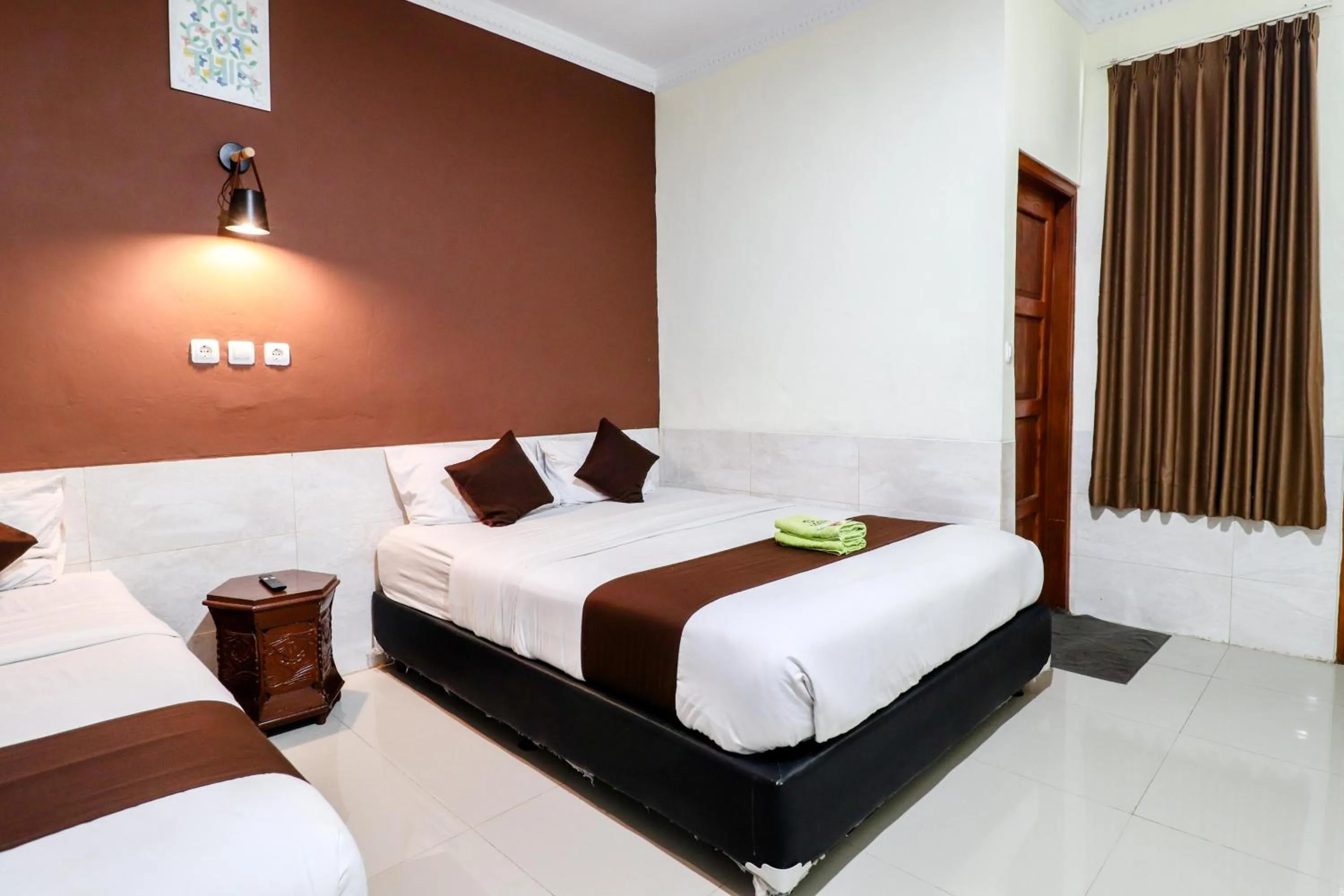 Bed in Hotel Safara Yogyakarta