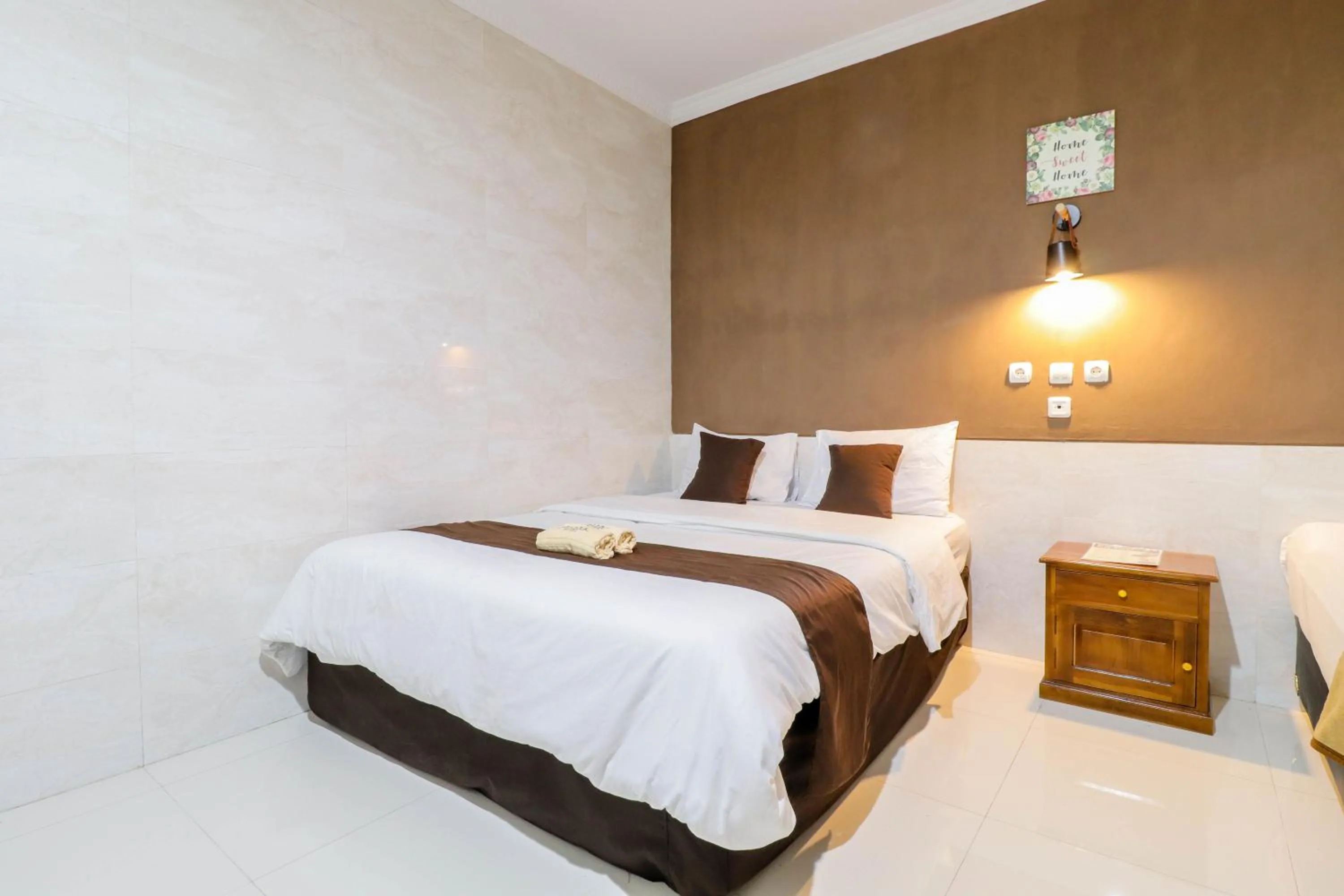 Bed in Hotel Safara Yogyakarta