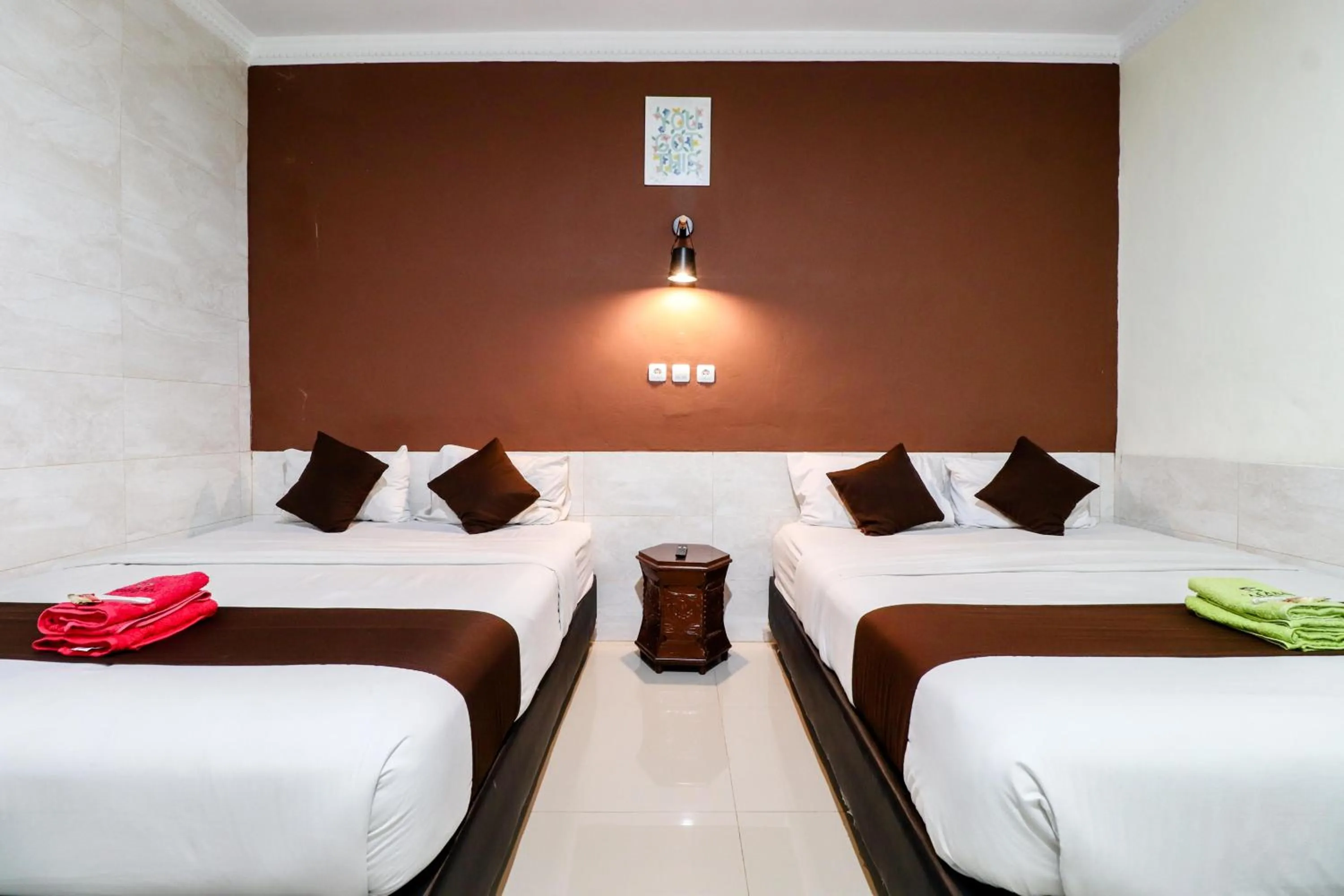 Bed in Hotel Safara Yogyakarta