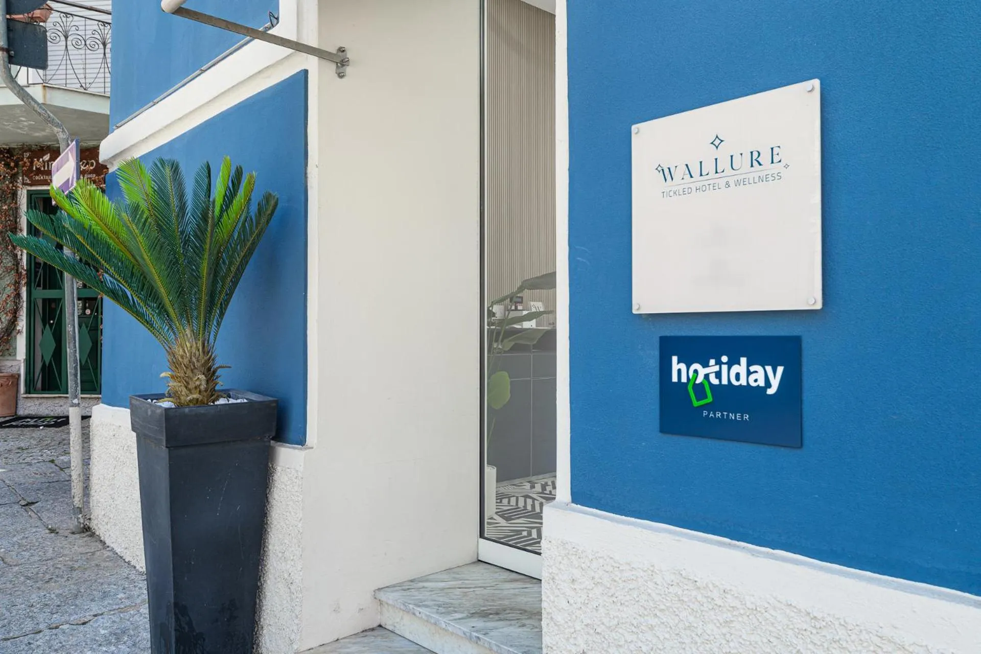 Property logo or sign in HOTIDAY Olbia Wallure