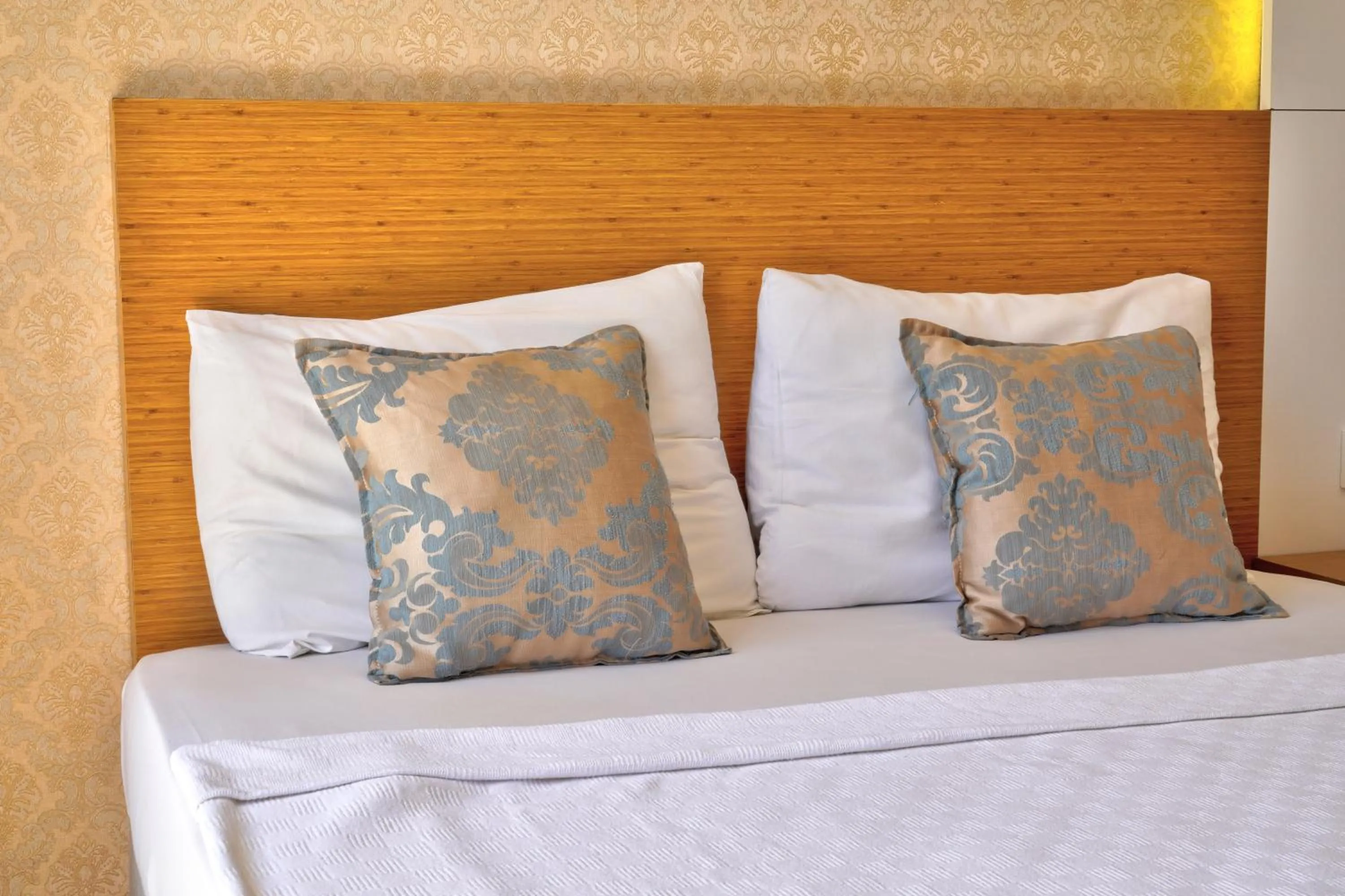 Bed in Blue Fish Hotel All Inclusive