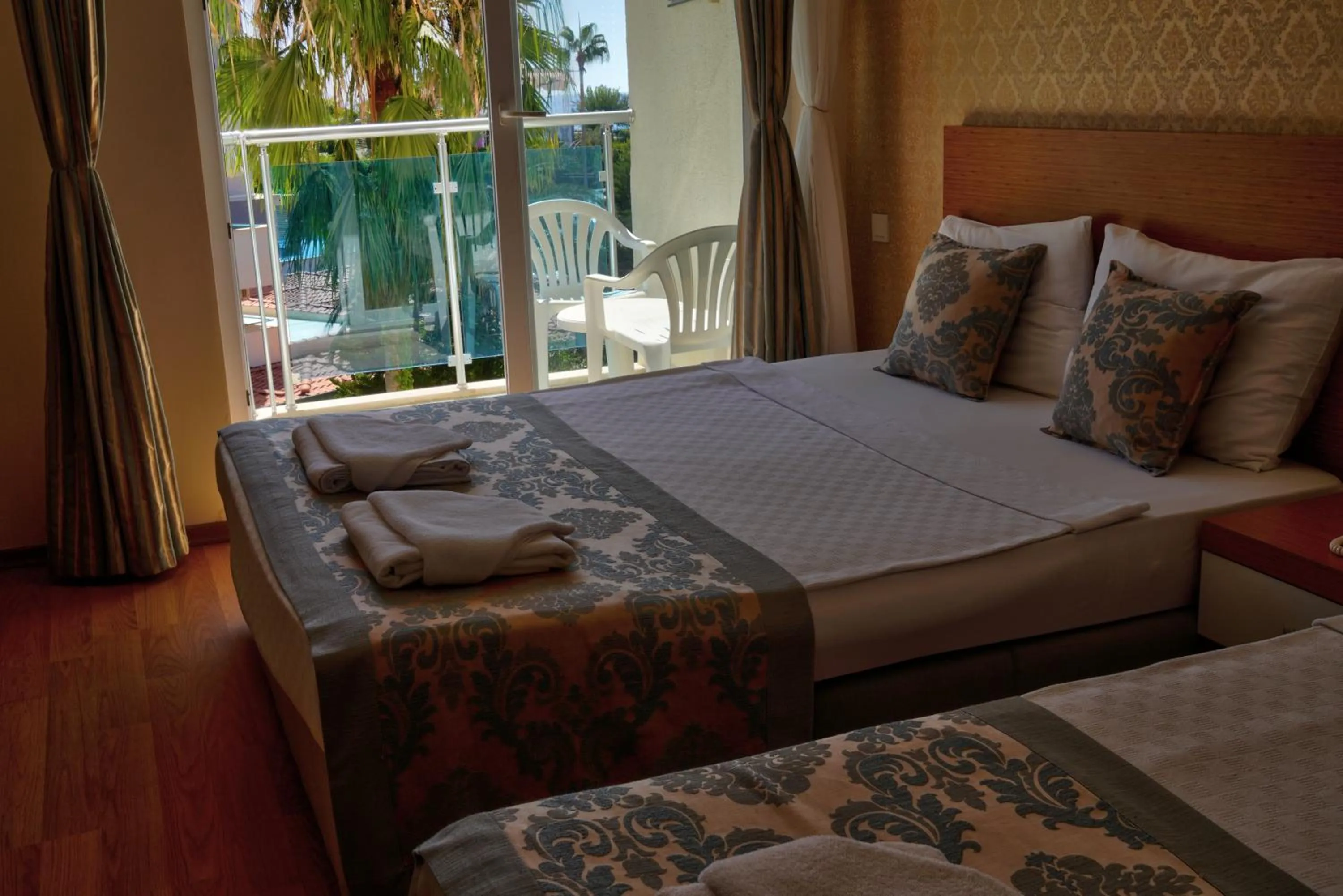 Bed in Blue Fish Hotel All Inclusive