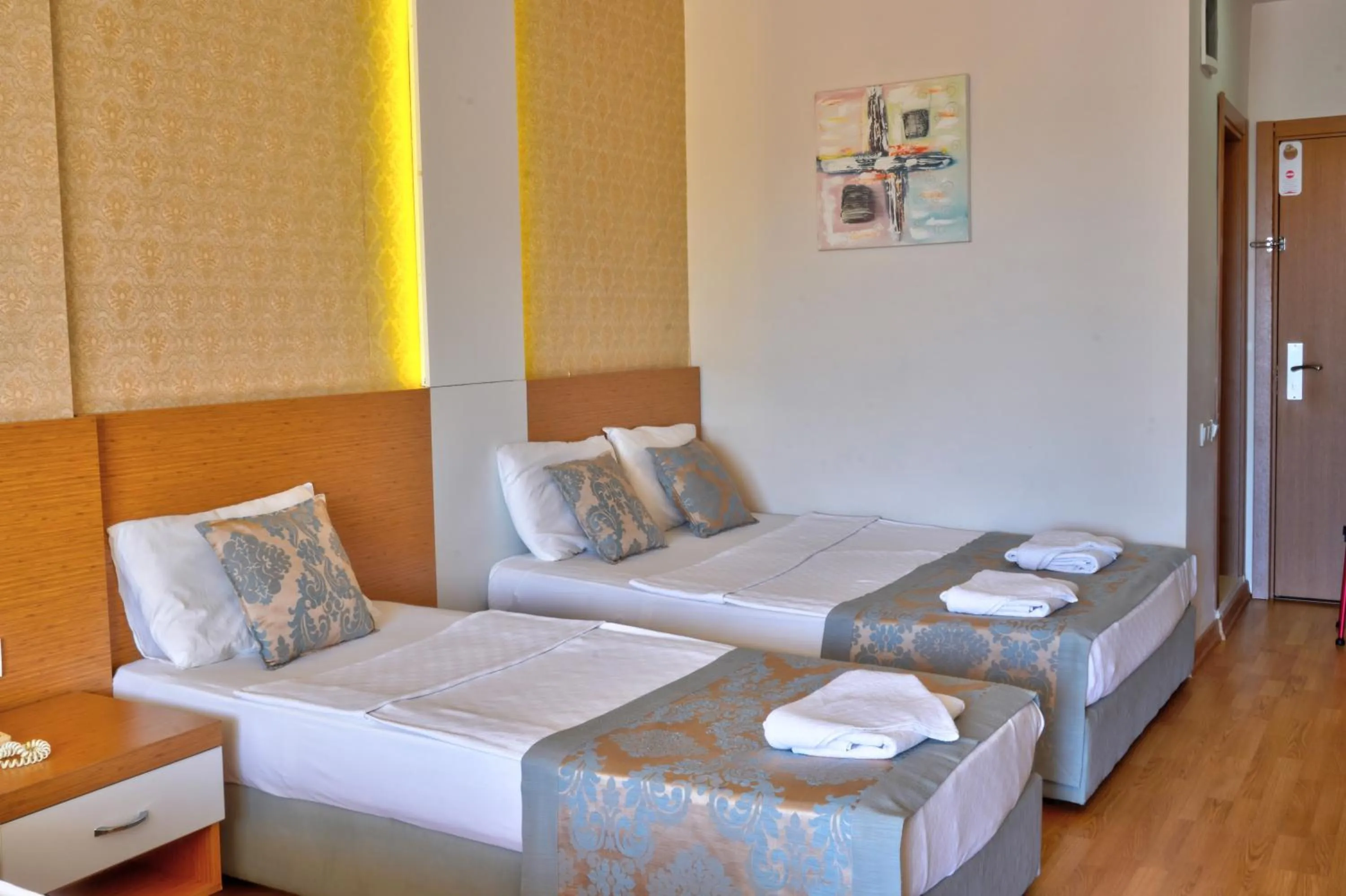 Bed in Blue Fish Hotel All Inclusive