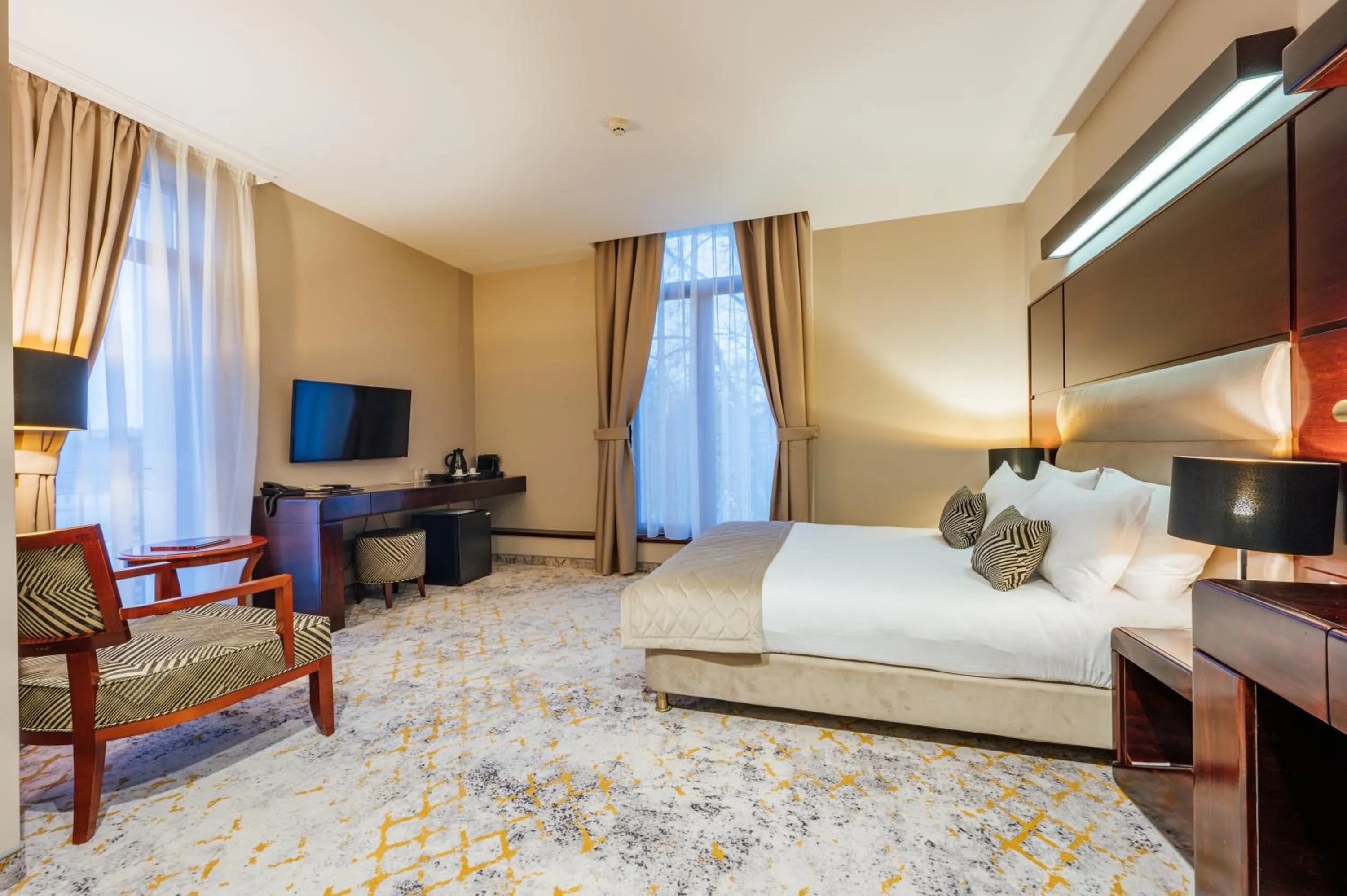 Bed in L`Art Hotel Carei