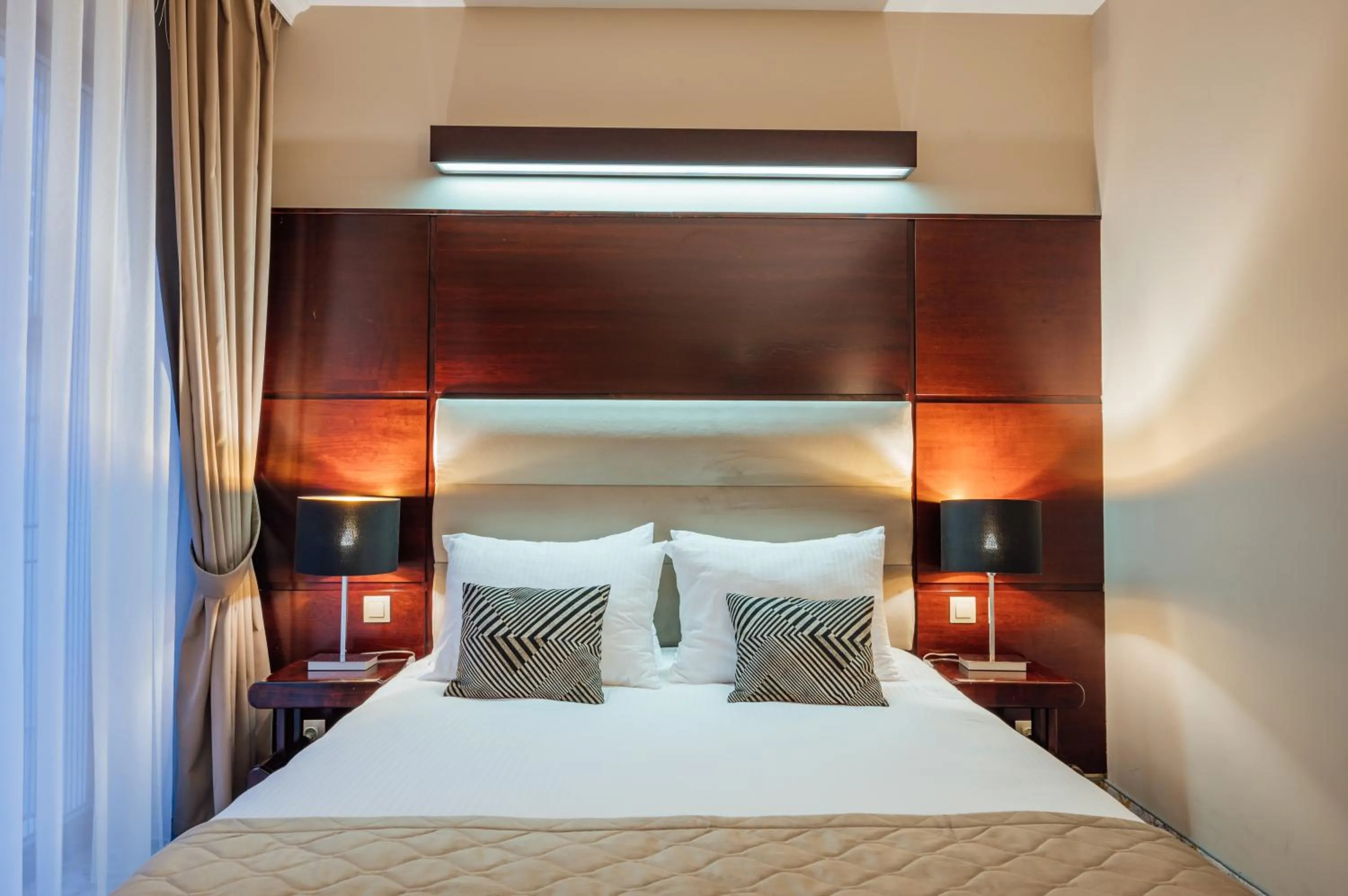 Bed in L`Art Hotel Carei