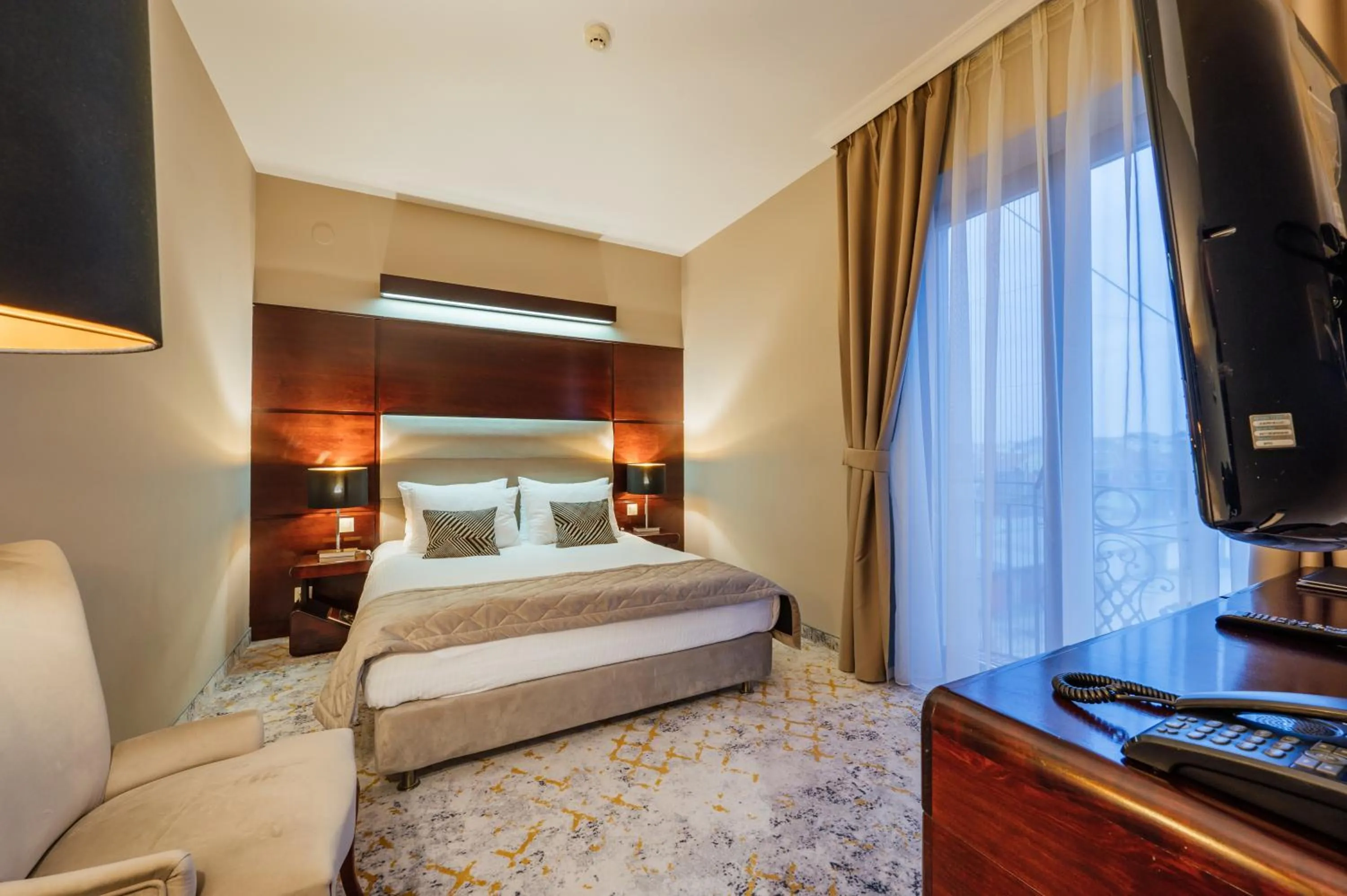 Bed in L`Art Hotel Carei