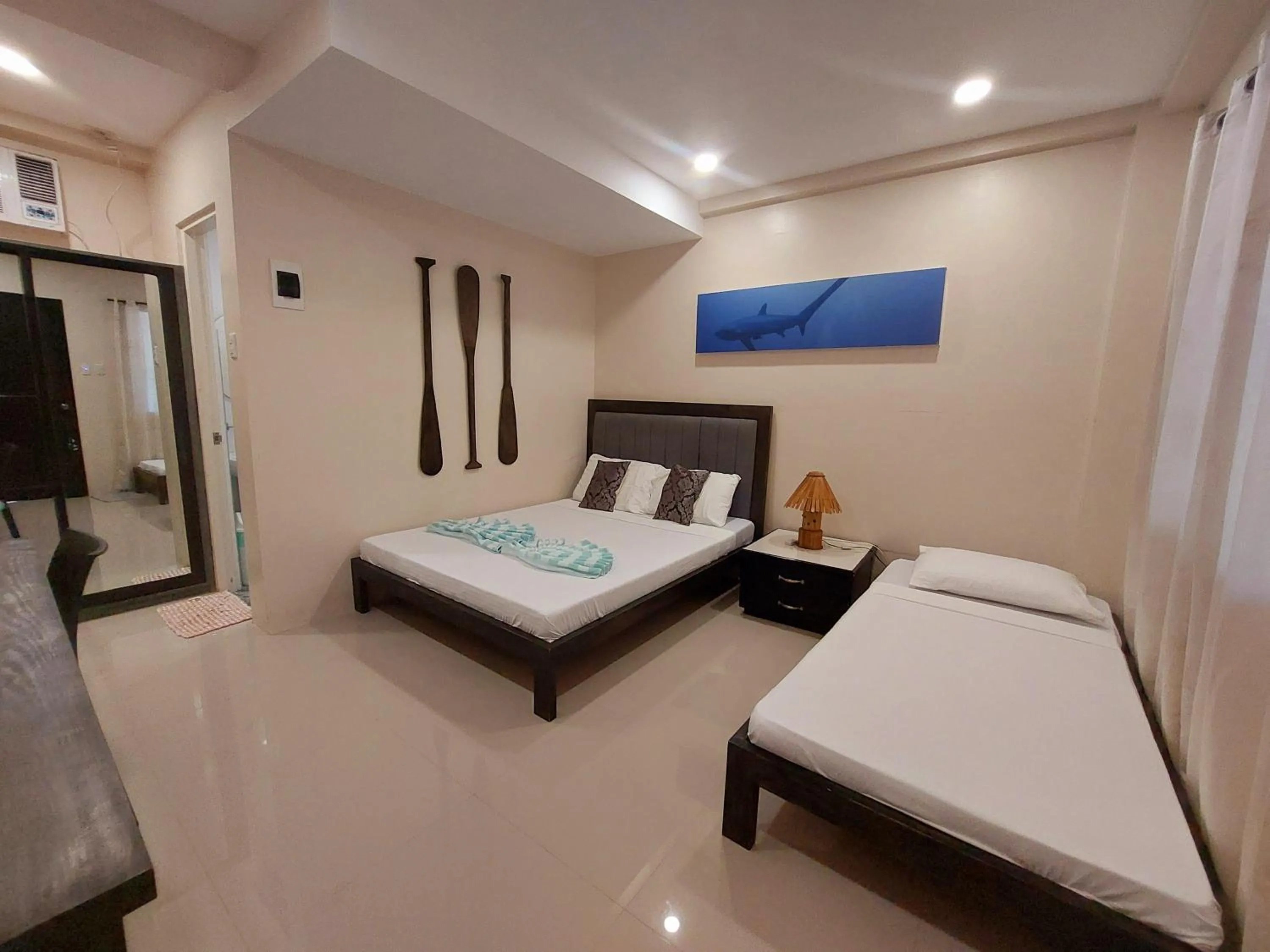 Bed in Avila's Horizon Dive Resort Malapascua