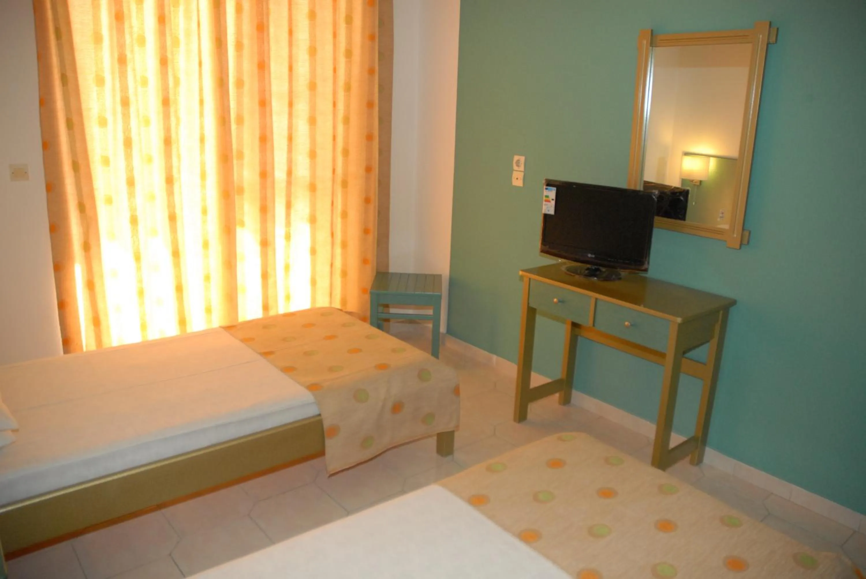 Bed in Trianta Hotel Apartments