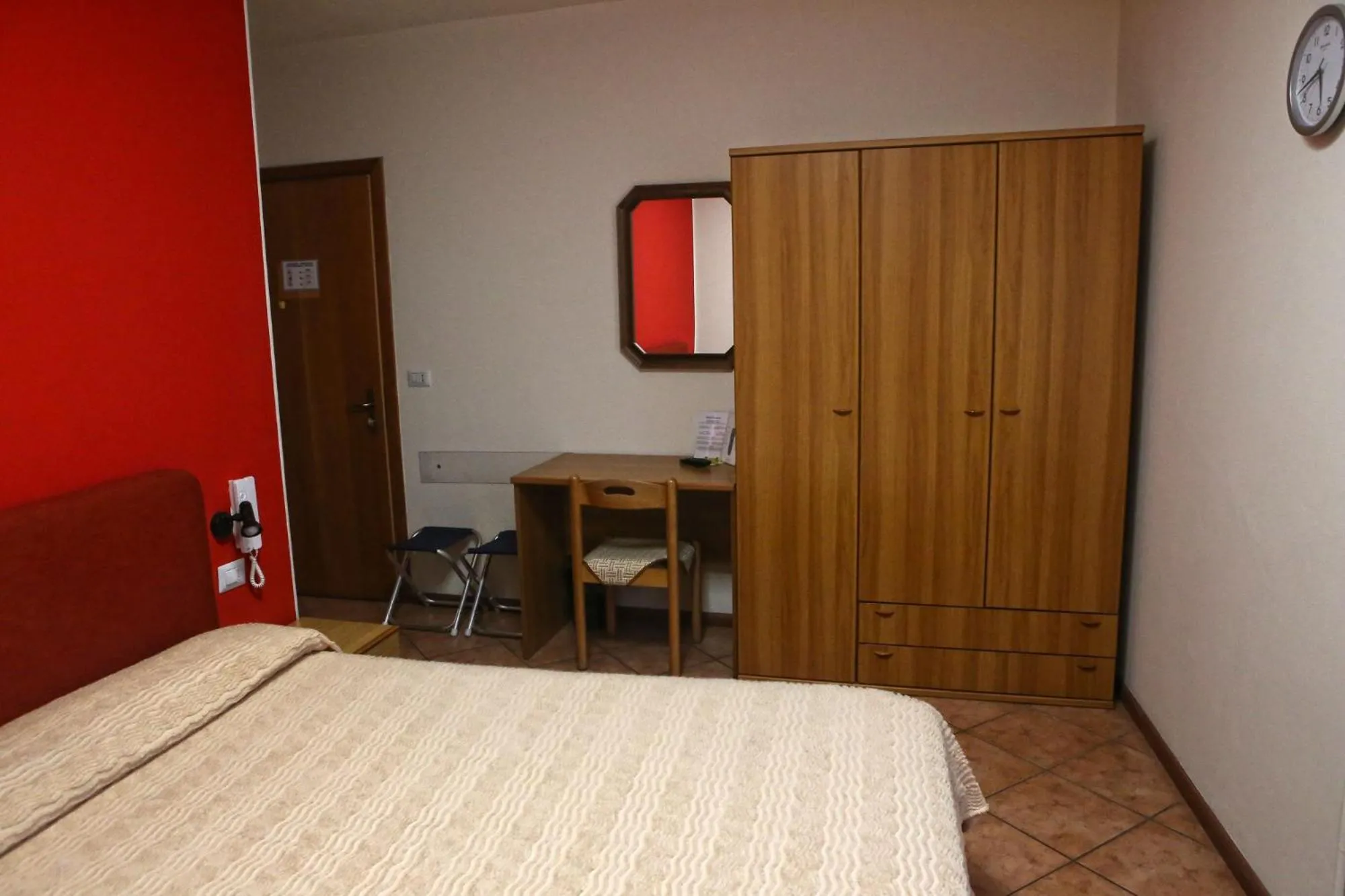 Bed in Albergo Gusmeroli