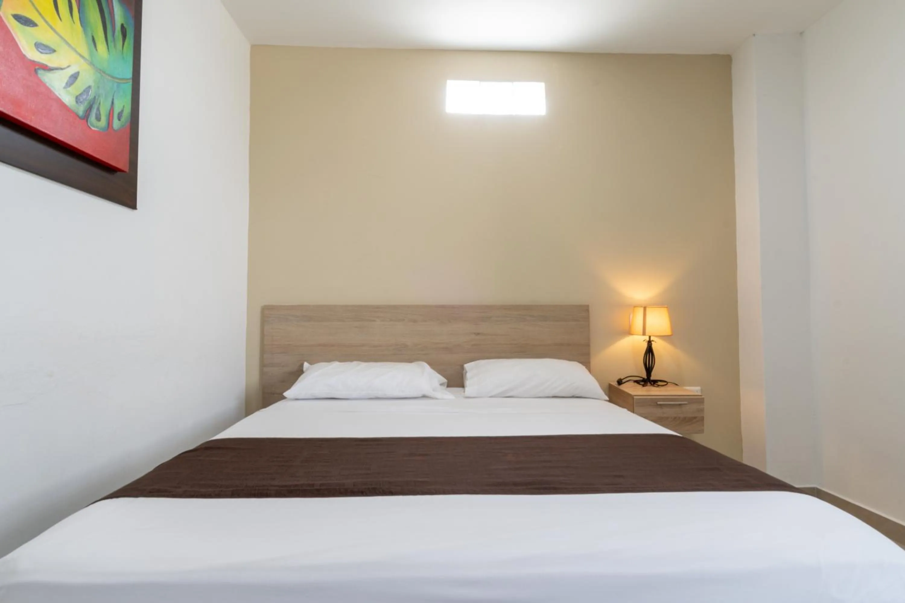 Bed in Genesis Hotel