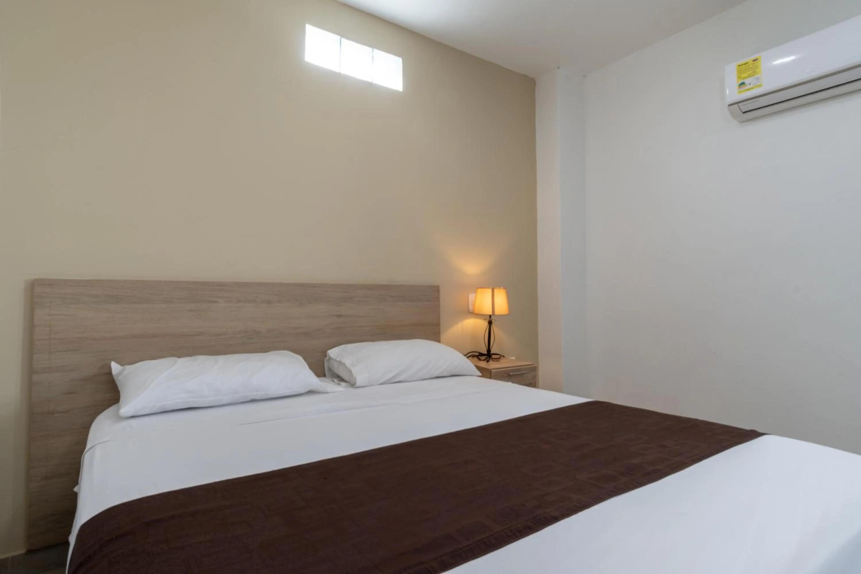 Bed in Genesis Hotel