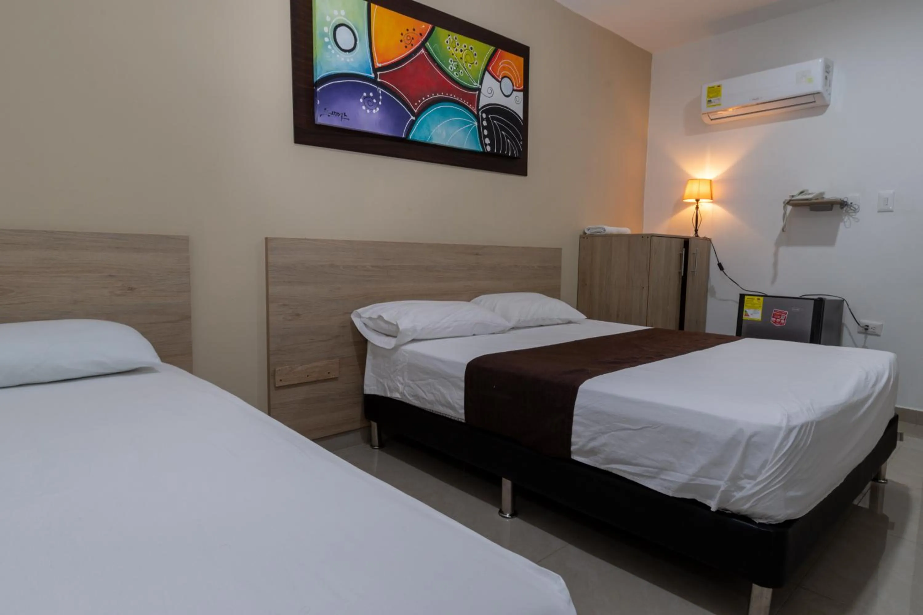 Bed in Genesis Hotel