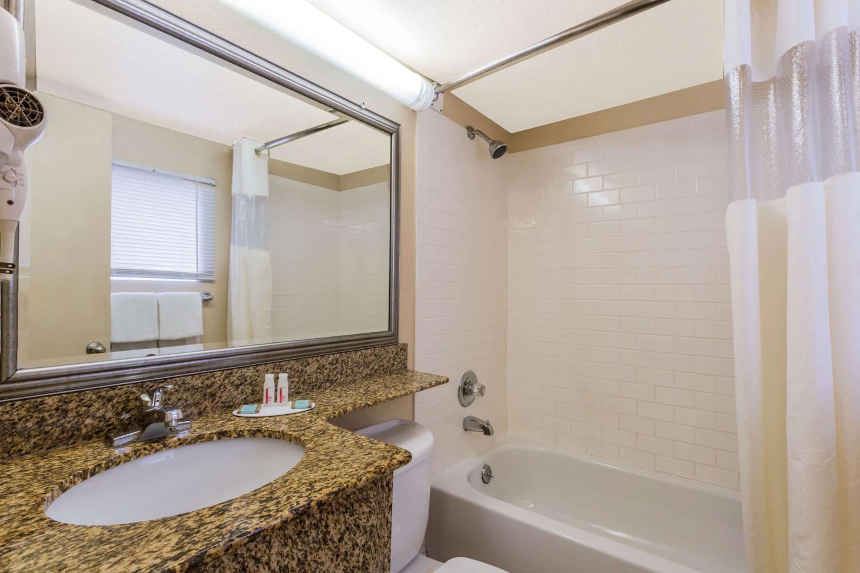 Bathroom in Travelodge by Wyndham Virginia Beach