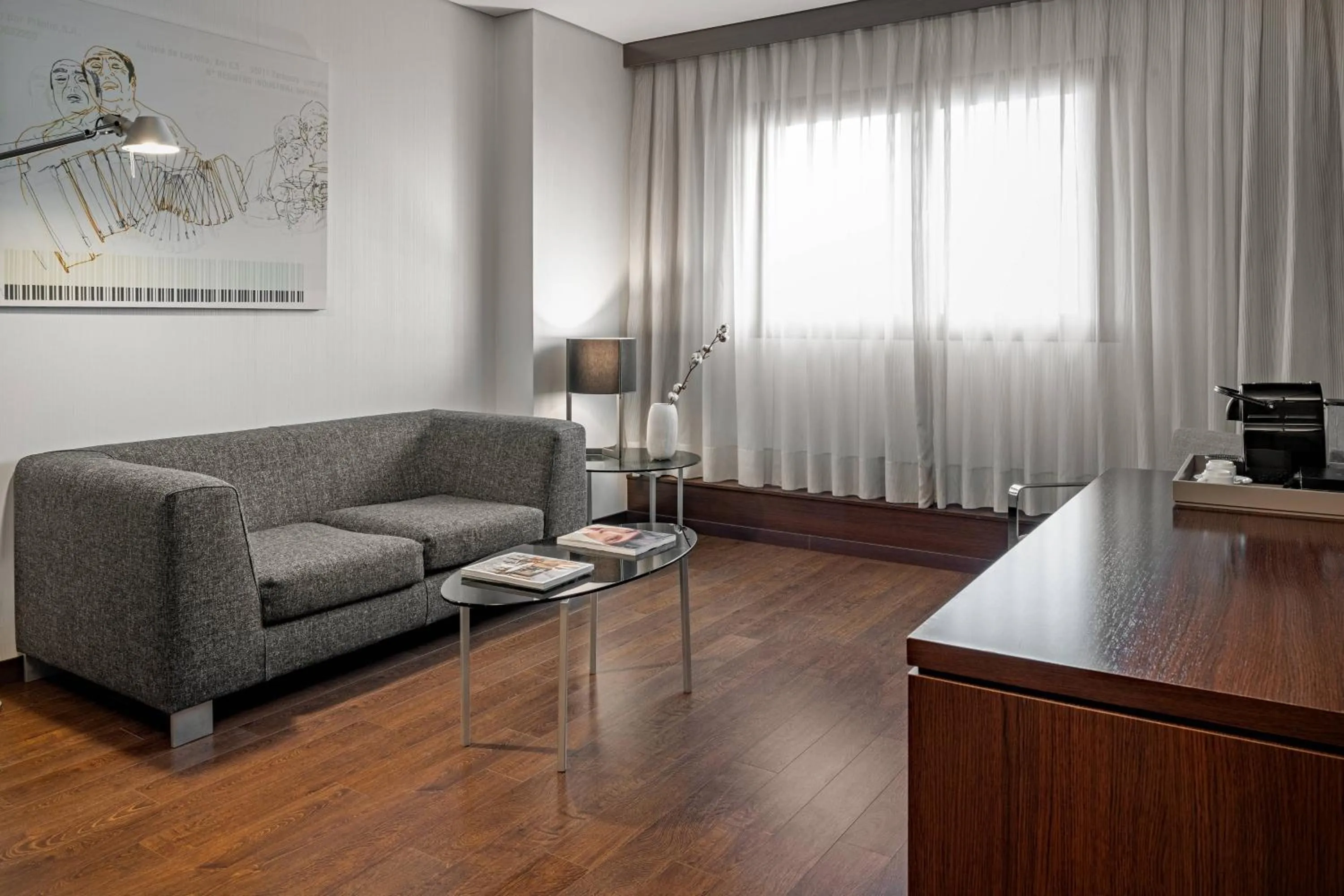 Living room in AC Hotel Porto by Marriott