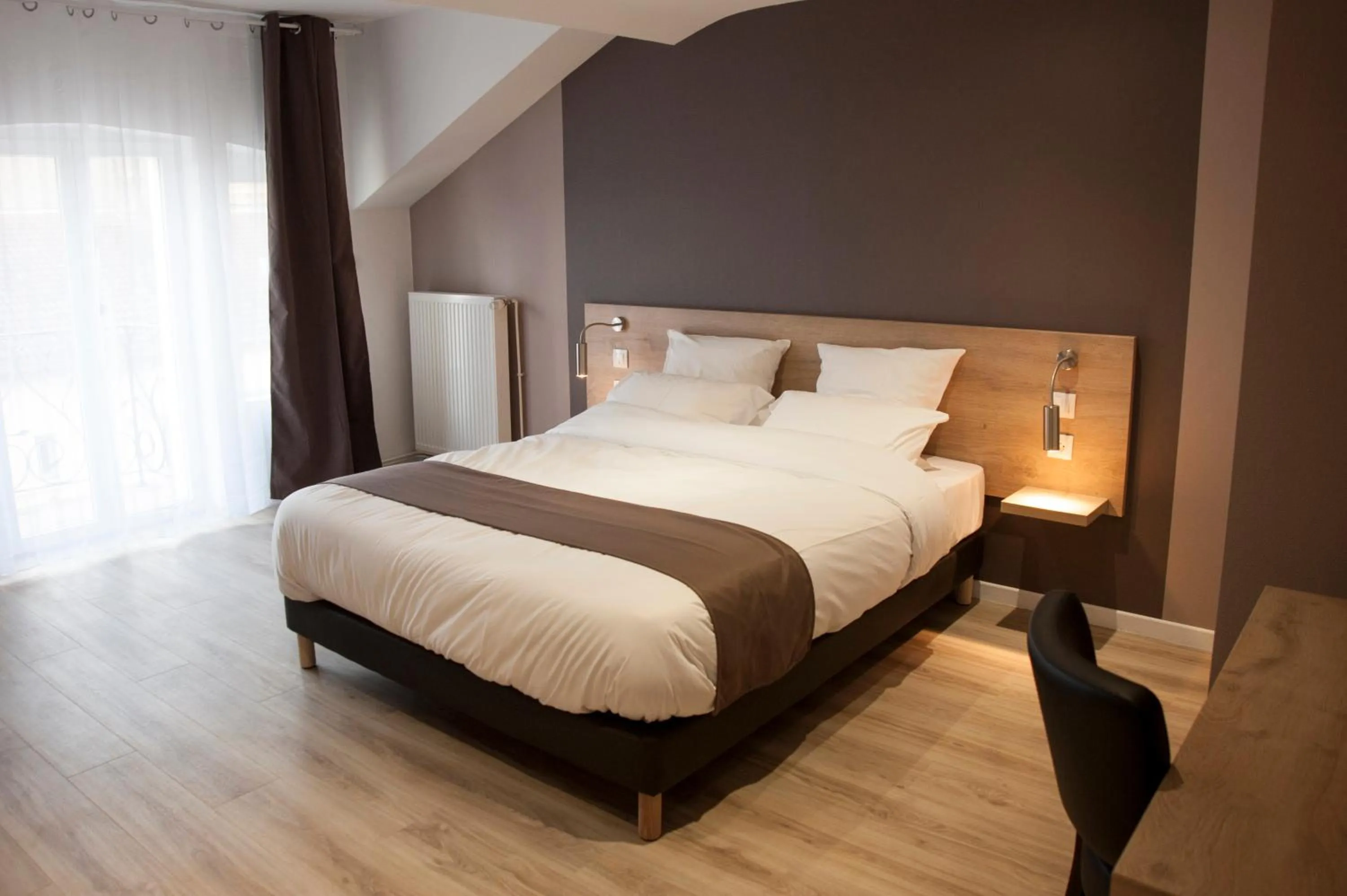 Bed in Logis Auberge Des Voyageurs