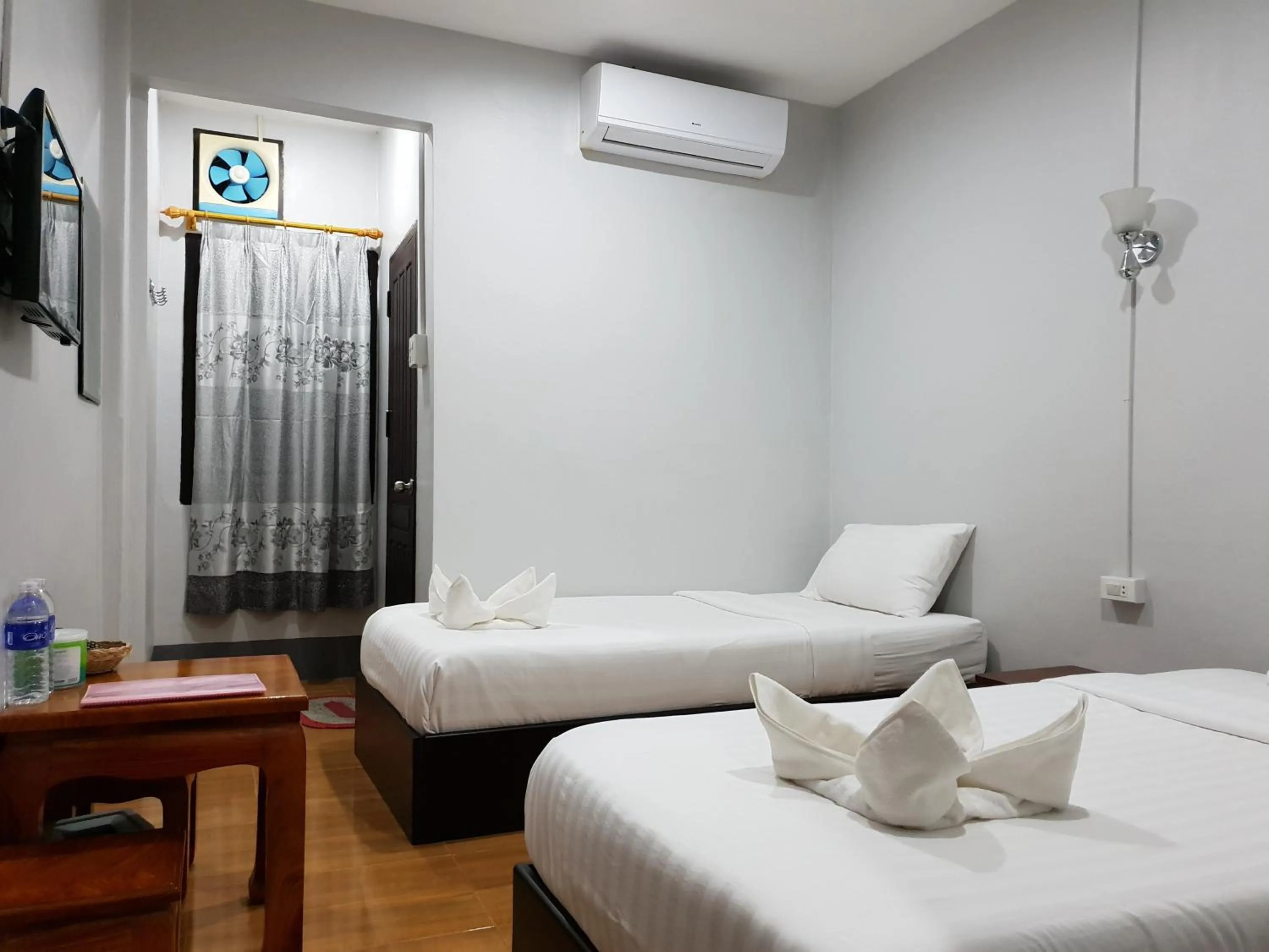 Bed in Phonethavy GUESTHOUSE