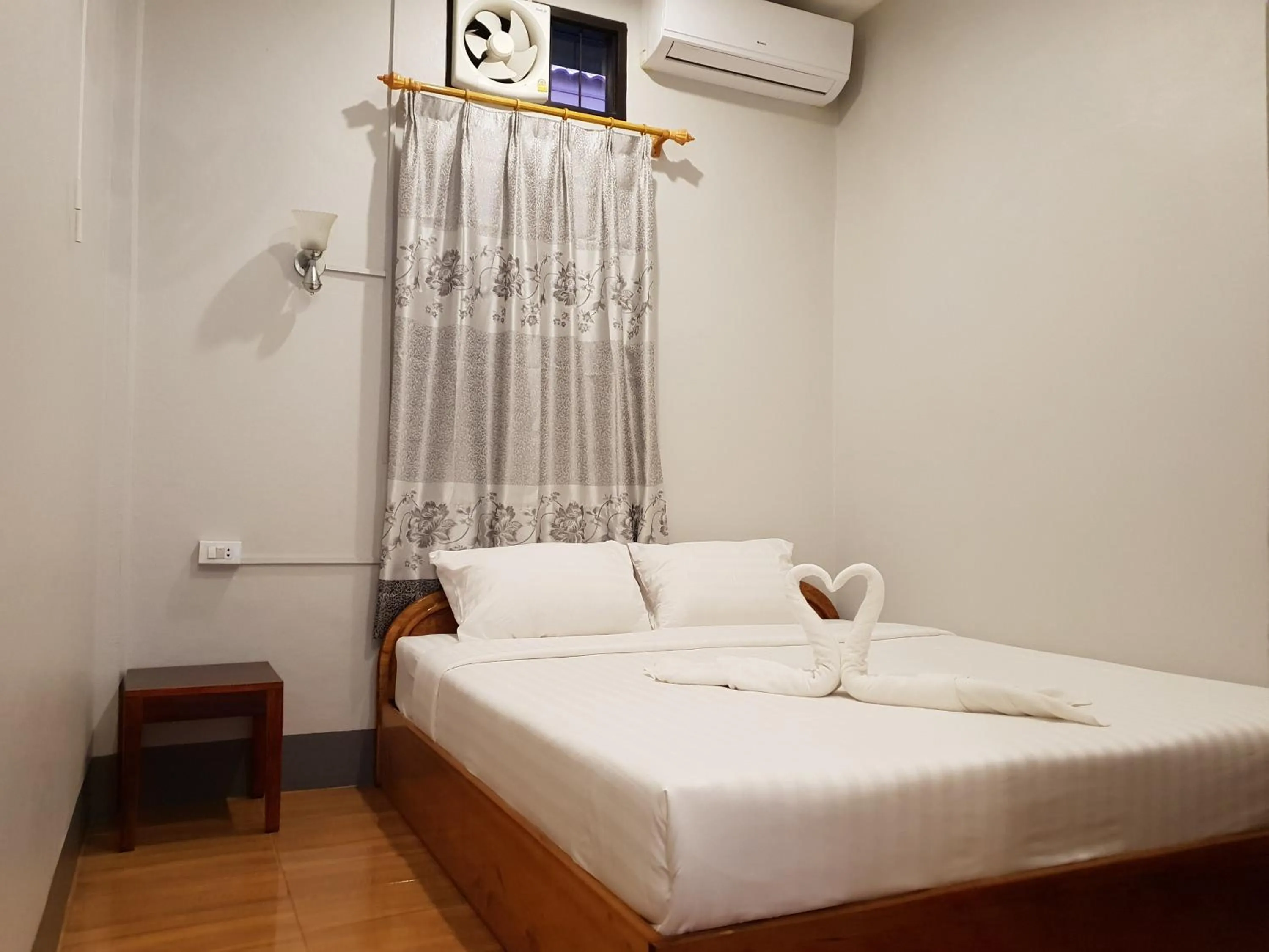 Bed in Phonethavy GUESTHOUSE
