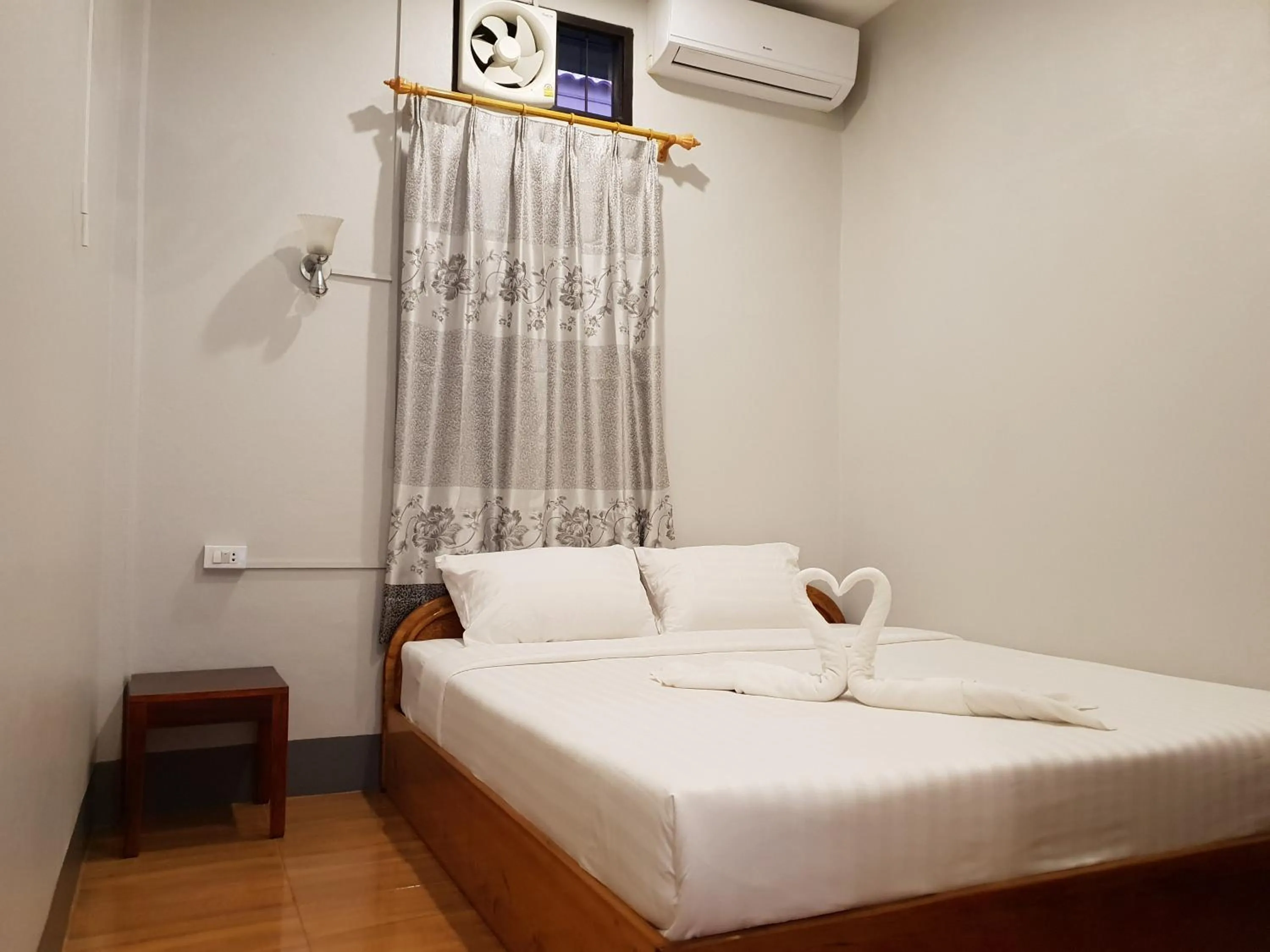 Bed in Phonethavy GUESTHOUSE