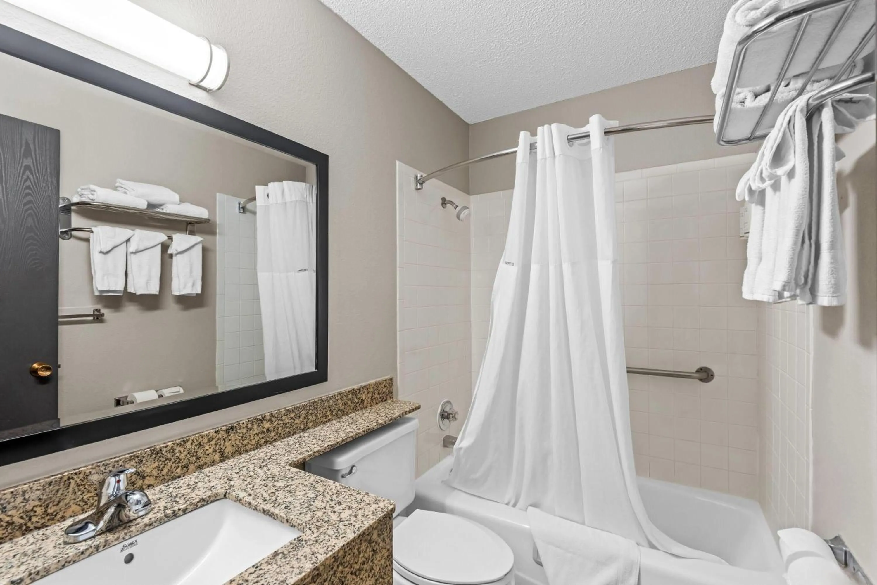 Bathroom in Days Inn & Suites by Wyndham Des Moines Airport