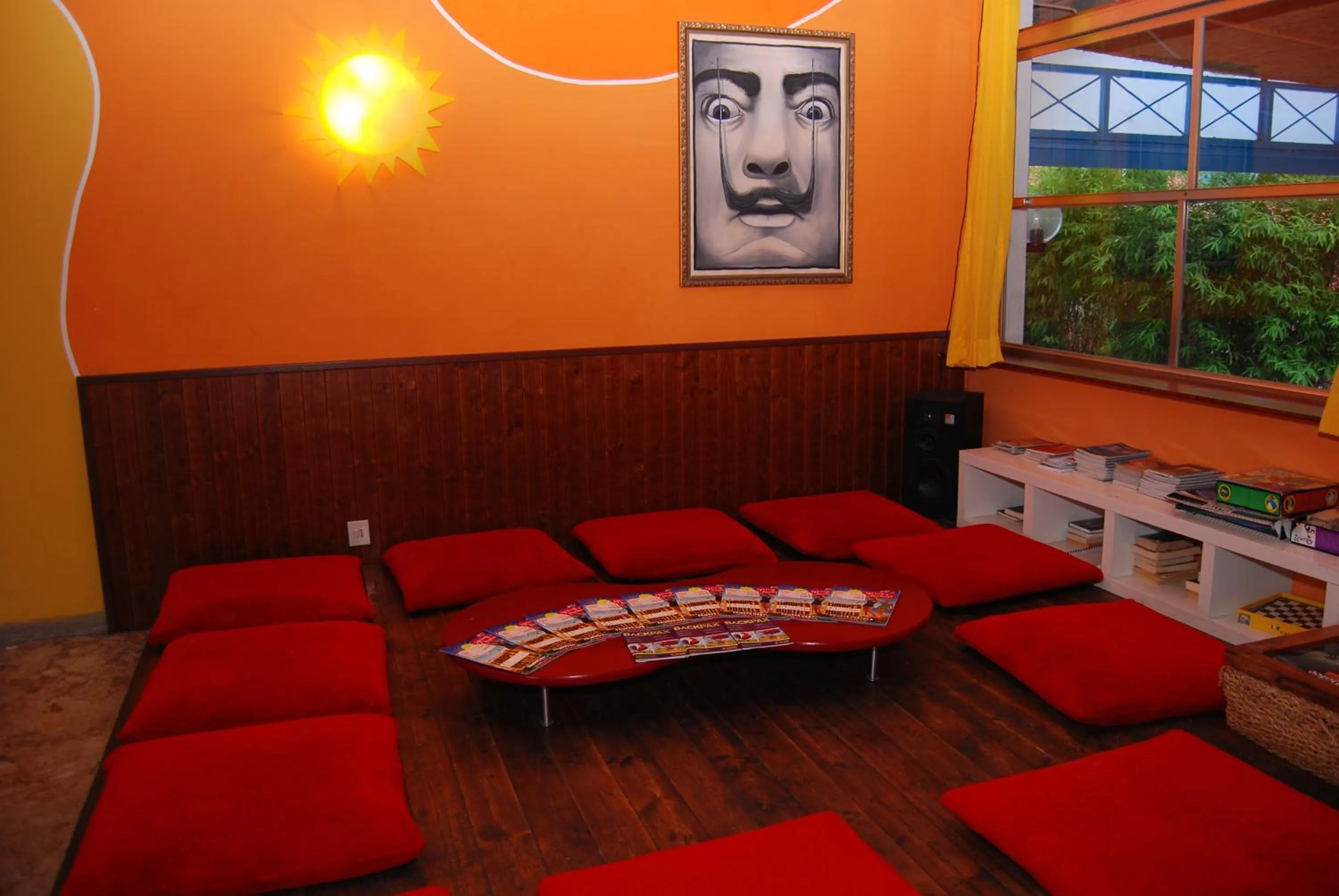 Communal lounge/ TV room in Sunflower Beach Backpacker Hostel & Bar