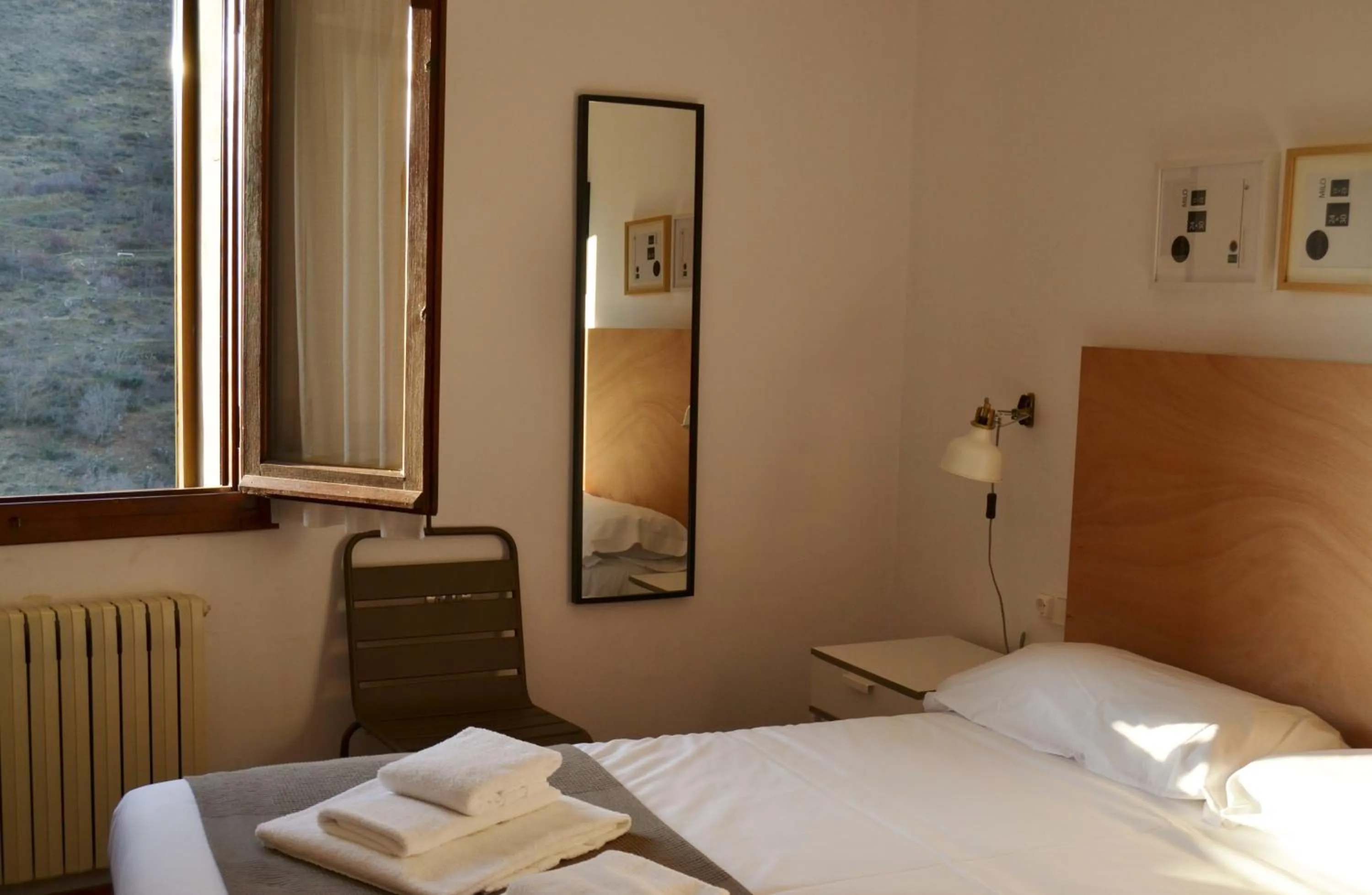 Photo of the whole room, Bed in Tres Puentes Anguiano Apartamentos y Hostal