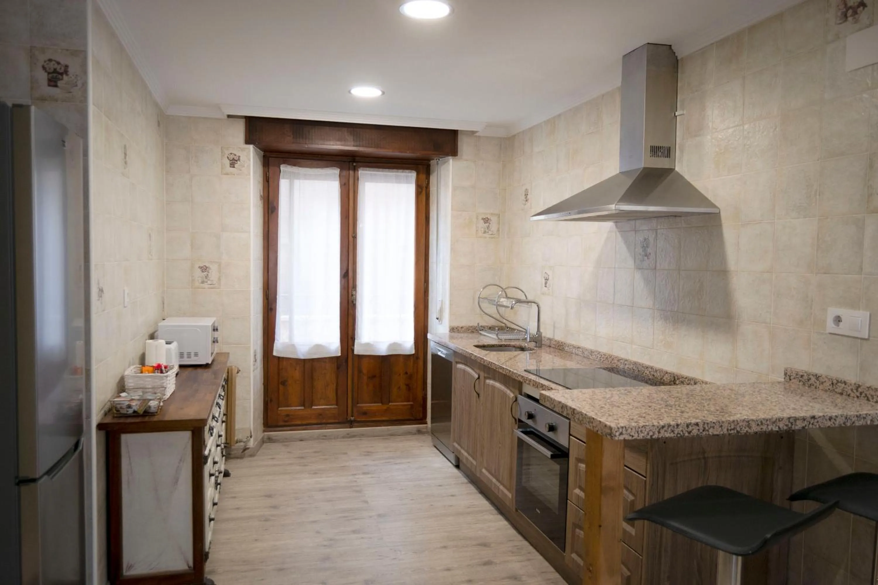 Kitchen or kitchenette in Tres Puentes Anguiano Apartamentos y Hostal