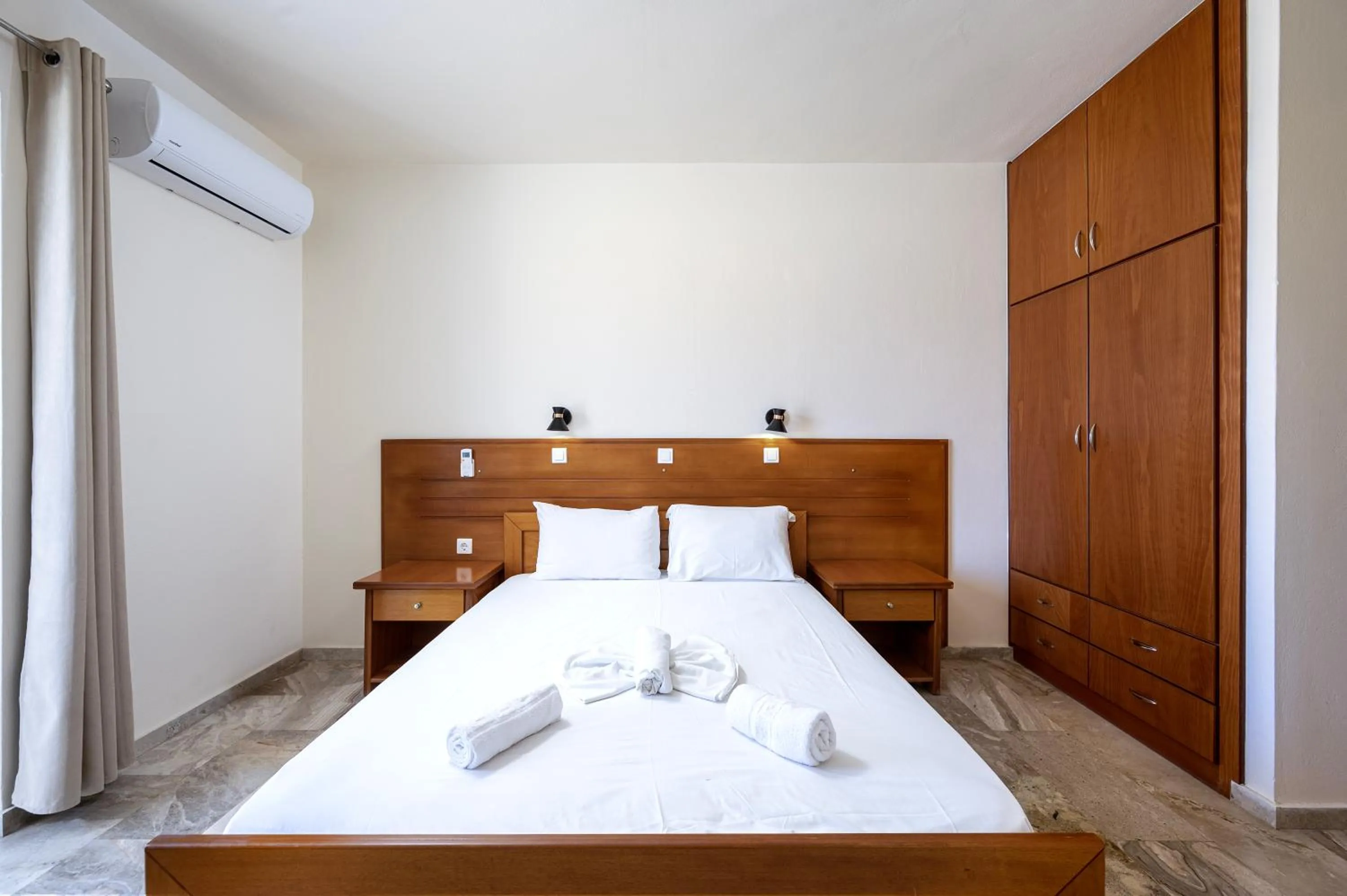 Bed in Mammis Beach Hotel