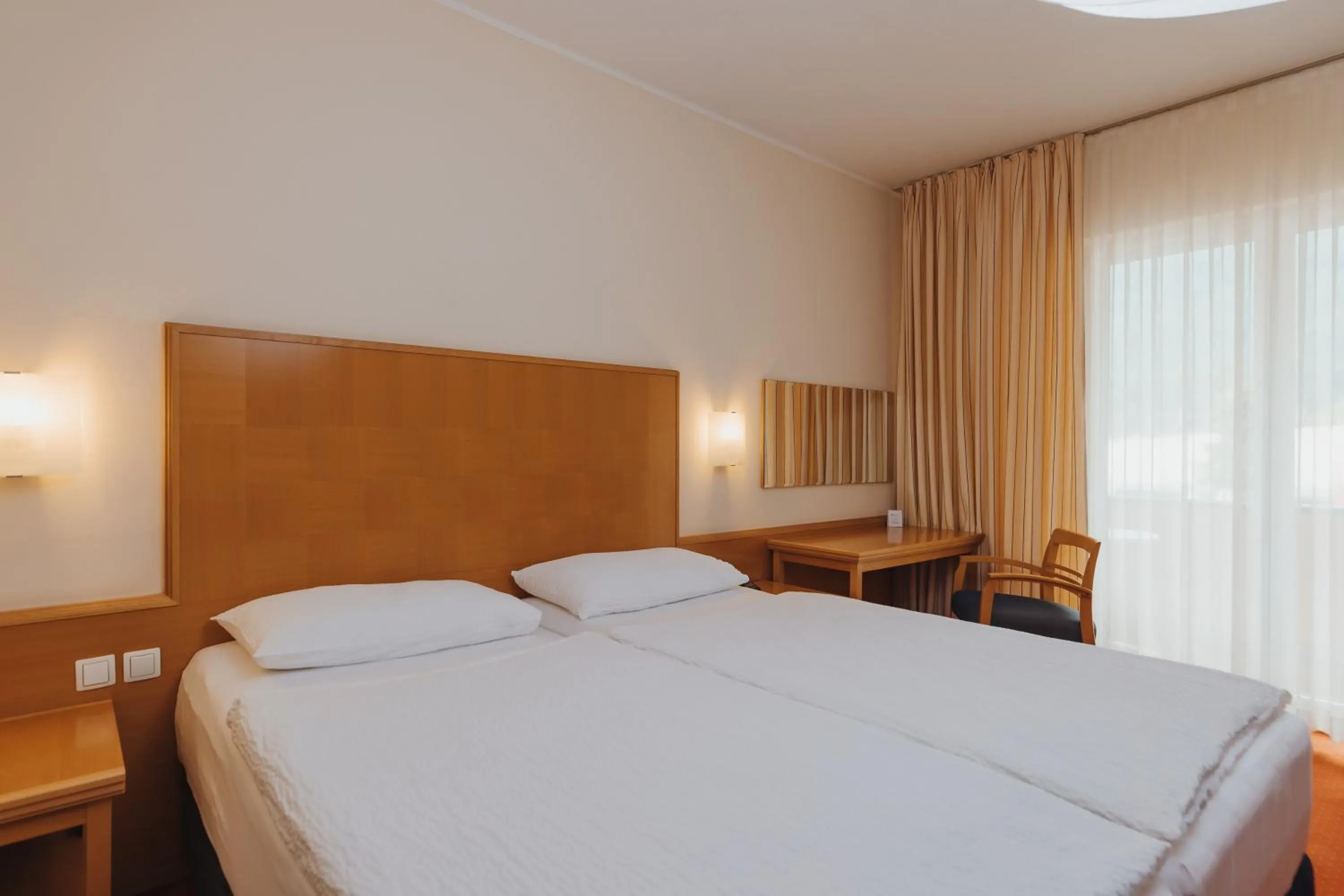 Bedroom, Bed in Ramada Hotel & Suites Kranjska Gora