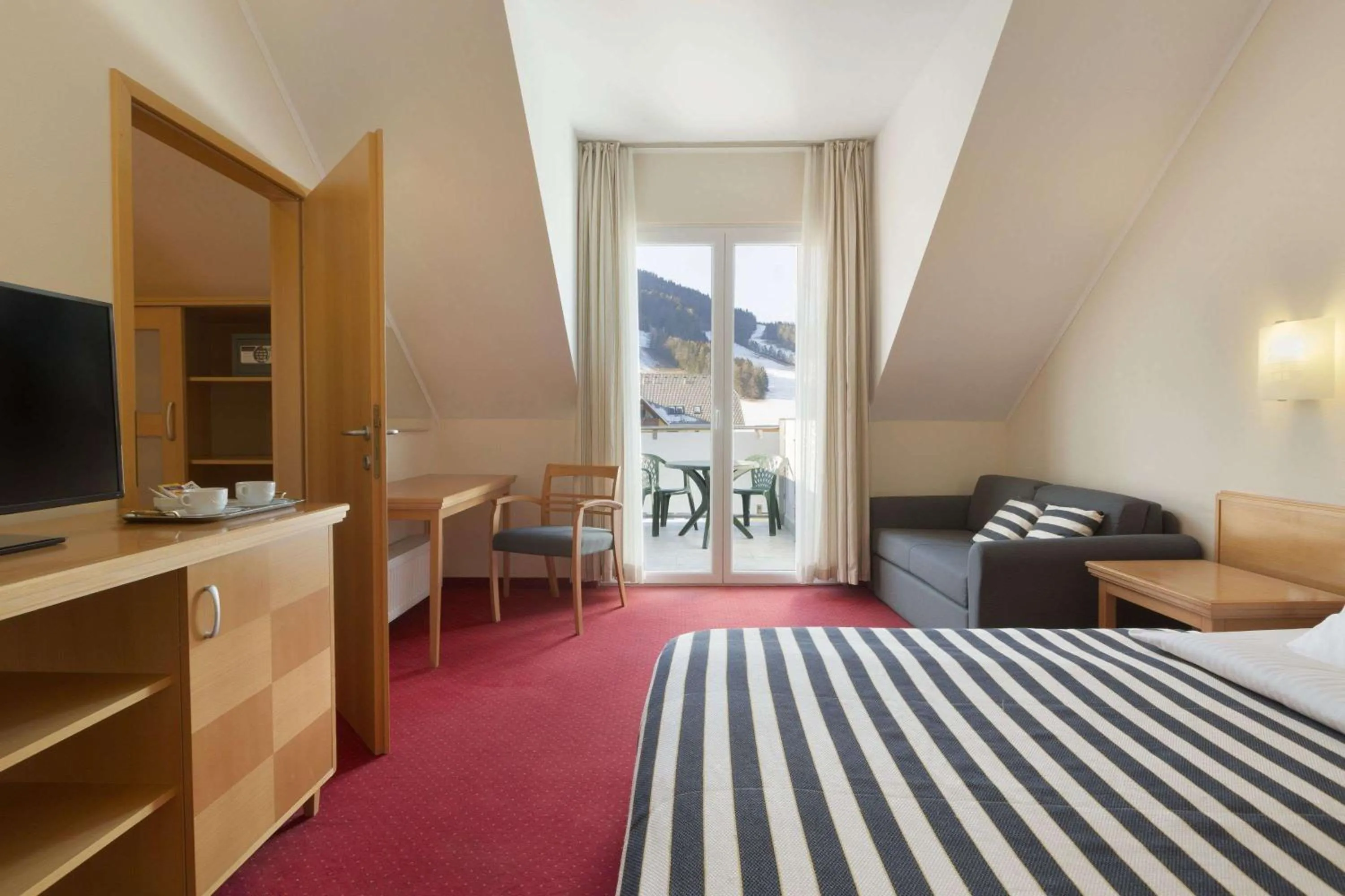 Photo of the whole room, Bed in Ramada Hotel & Suites Kranjska Gora