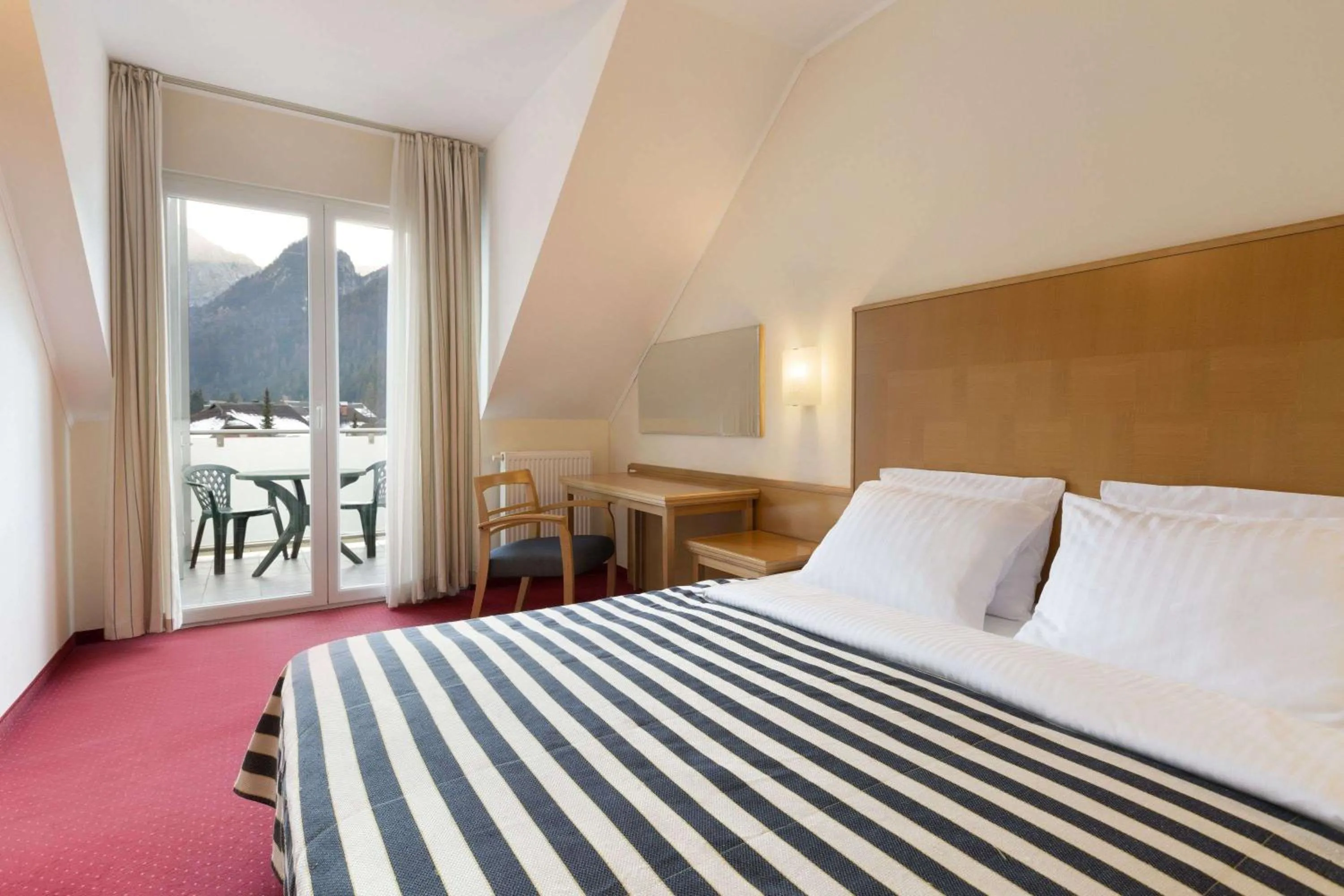 Photo of the whole room, Bed in Ramada Hotel & Suites Kranjska Gora
