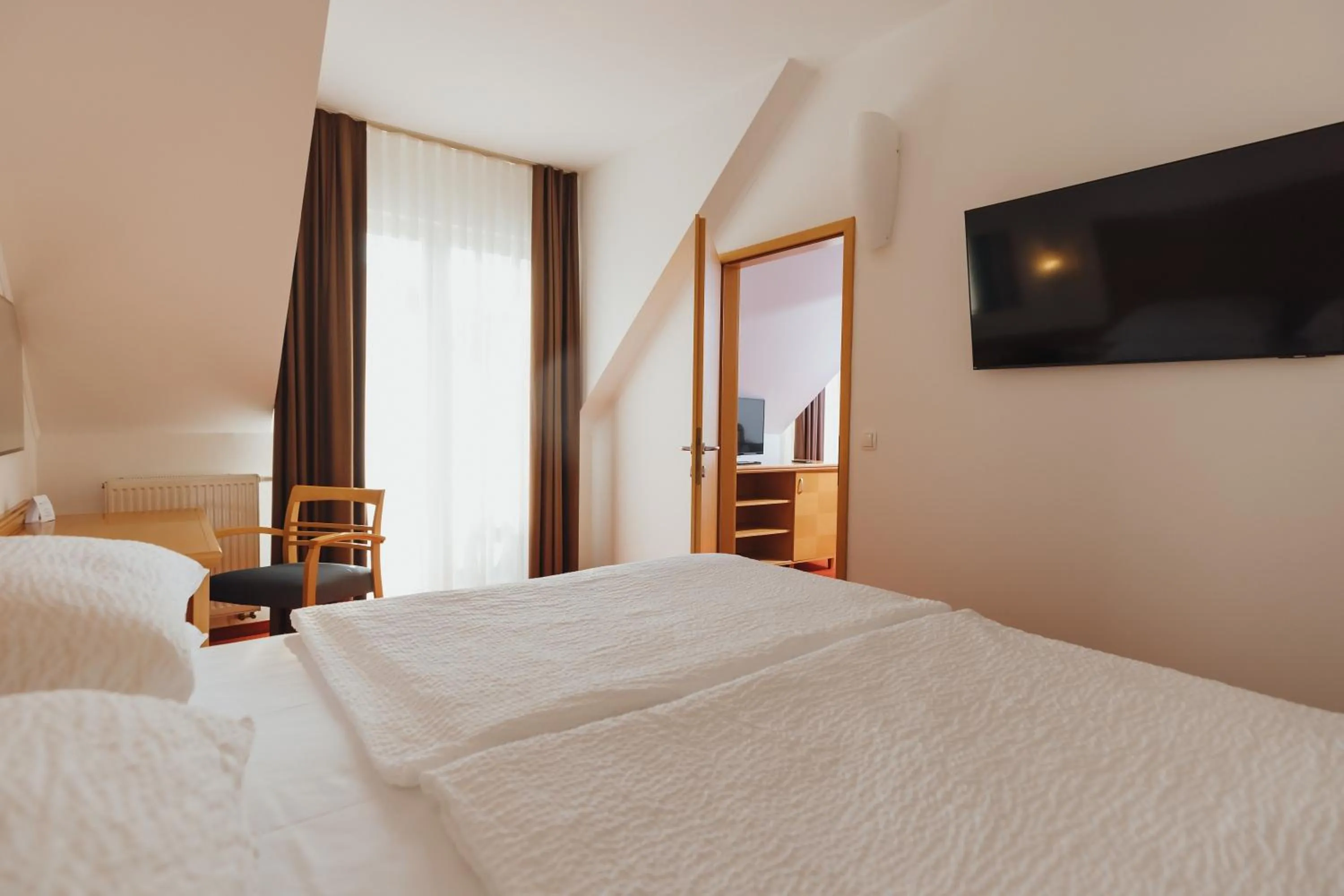 Bedroom, Bed in Ramada Hotel & Suites Kranjska Gora