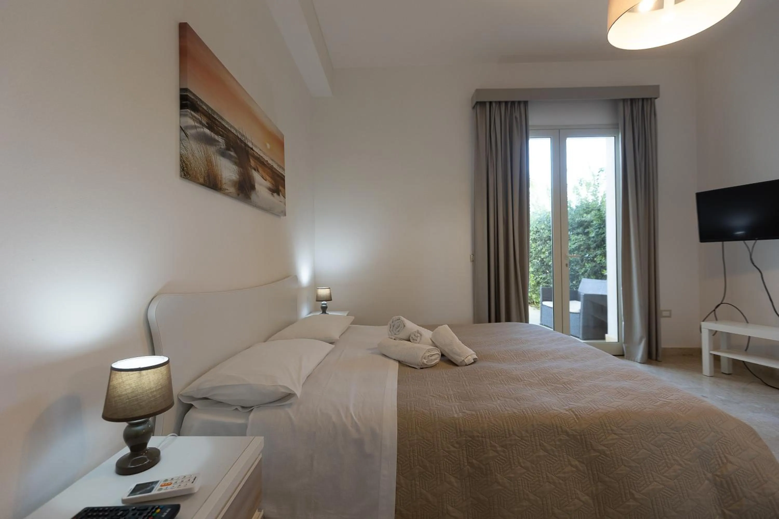 Bed in La Rosa Dei Venti - Free Parking, Air Conditioning and Wi-Fi